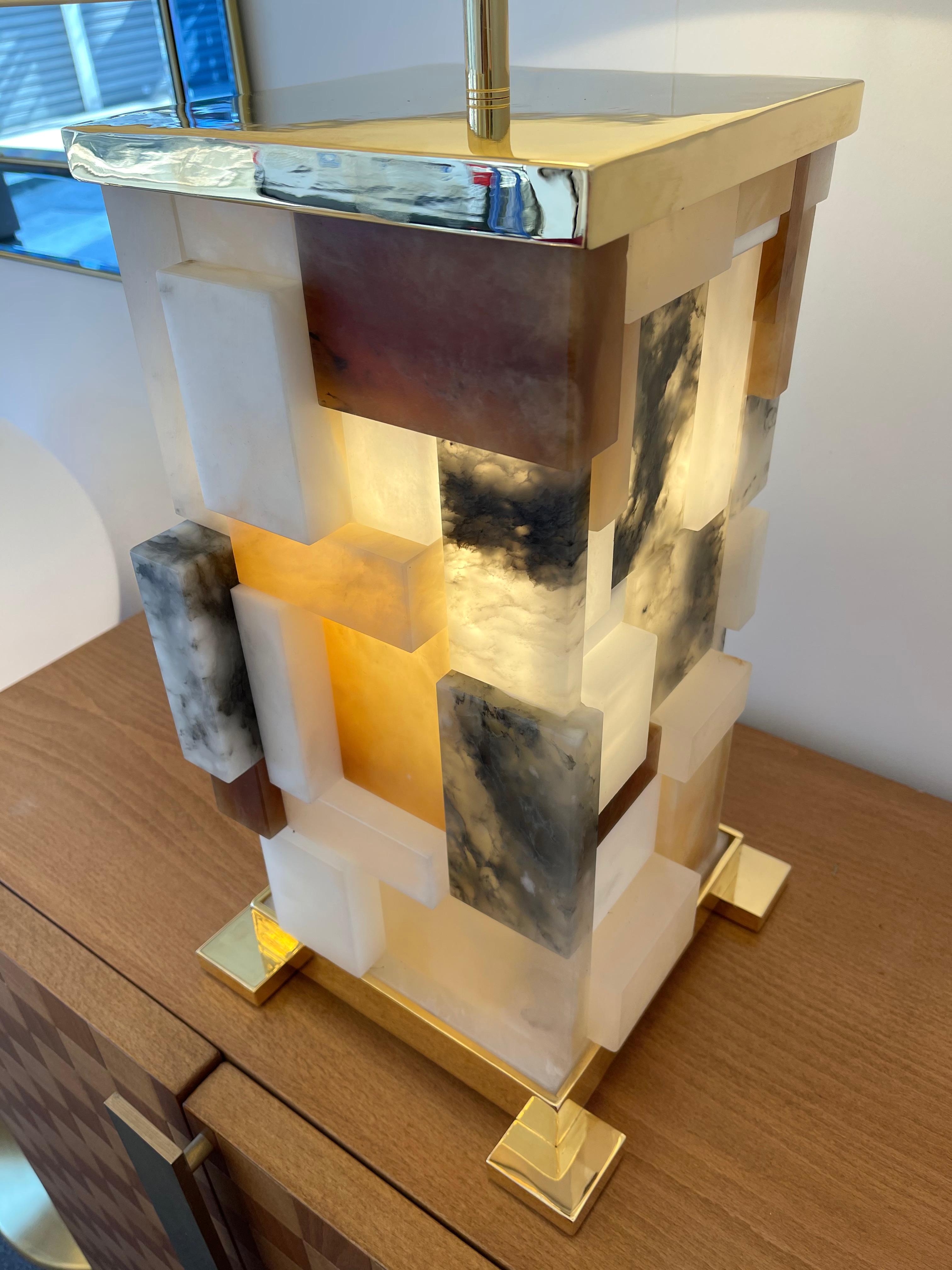 Pair of patchwork cubismi alabaster marquetry and 24k gilt metal table lamps. Intern retro lightning. Each lamps are unique in construction. Contemporary work, Few exclusive artistically production by the artist Antonio Cagianelli. A different work