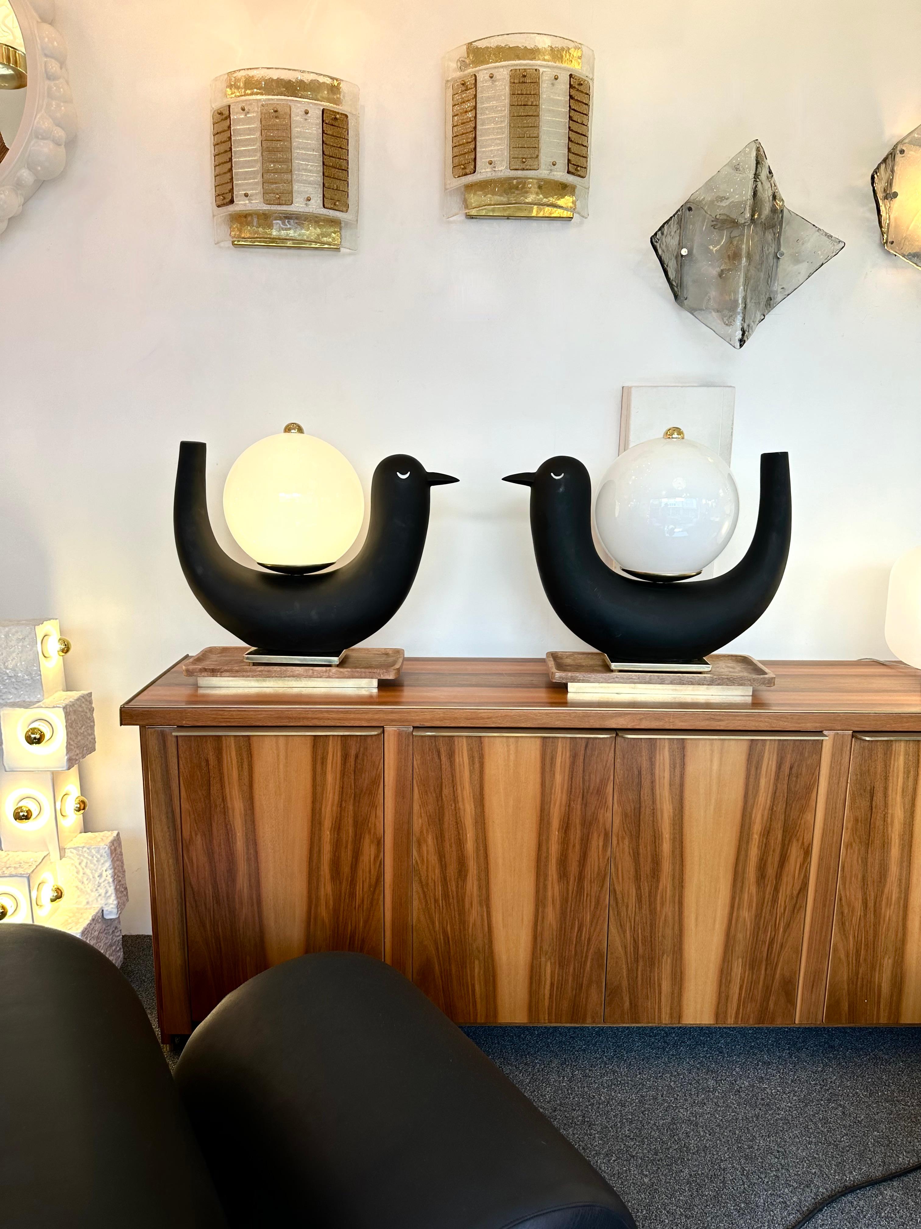 Pair of table or bedside Black bird lamps, white Opaline Murano glass, black painted resin style ceramic terracotta, brass and natural wood. Contemporary work from a small italian artisanal design workshop in a Mid-Century Modern, Brutalist style.