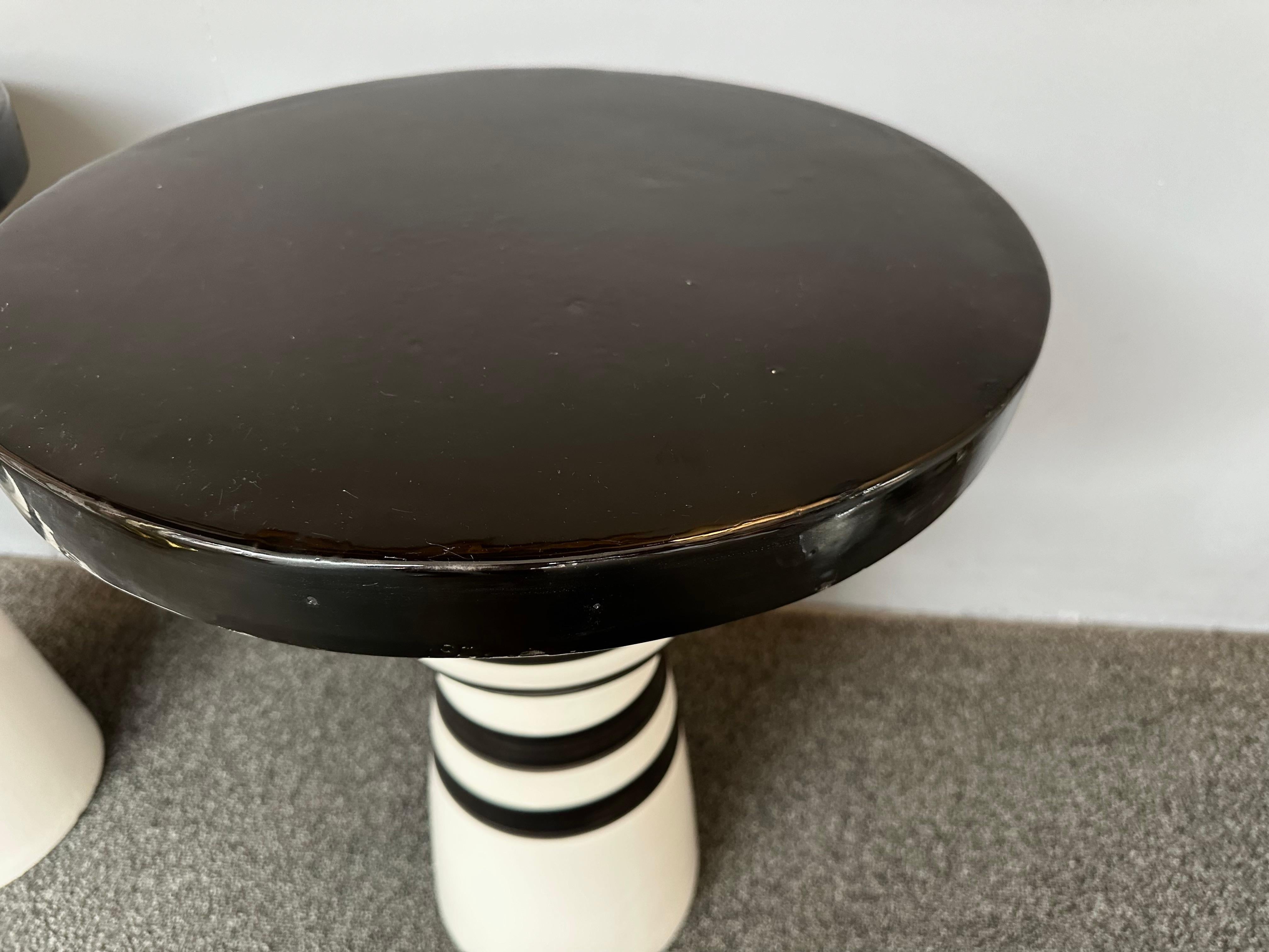 Pair of black and white stripe decor ceramic terracotta side end low coffee cocktail bedside tables or nightstands. Italian design workshop,  Minor imperfections due to artisanal Handmade work. In the mood of Mid-Century Modern Mario Botta, Memphis