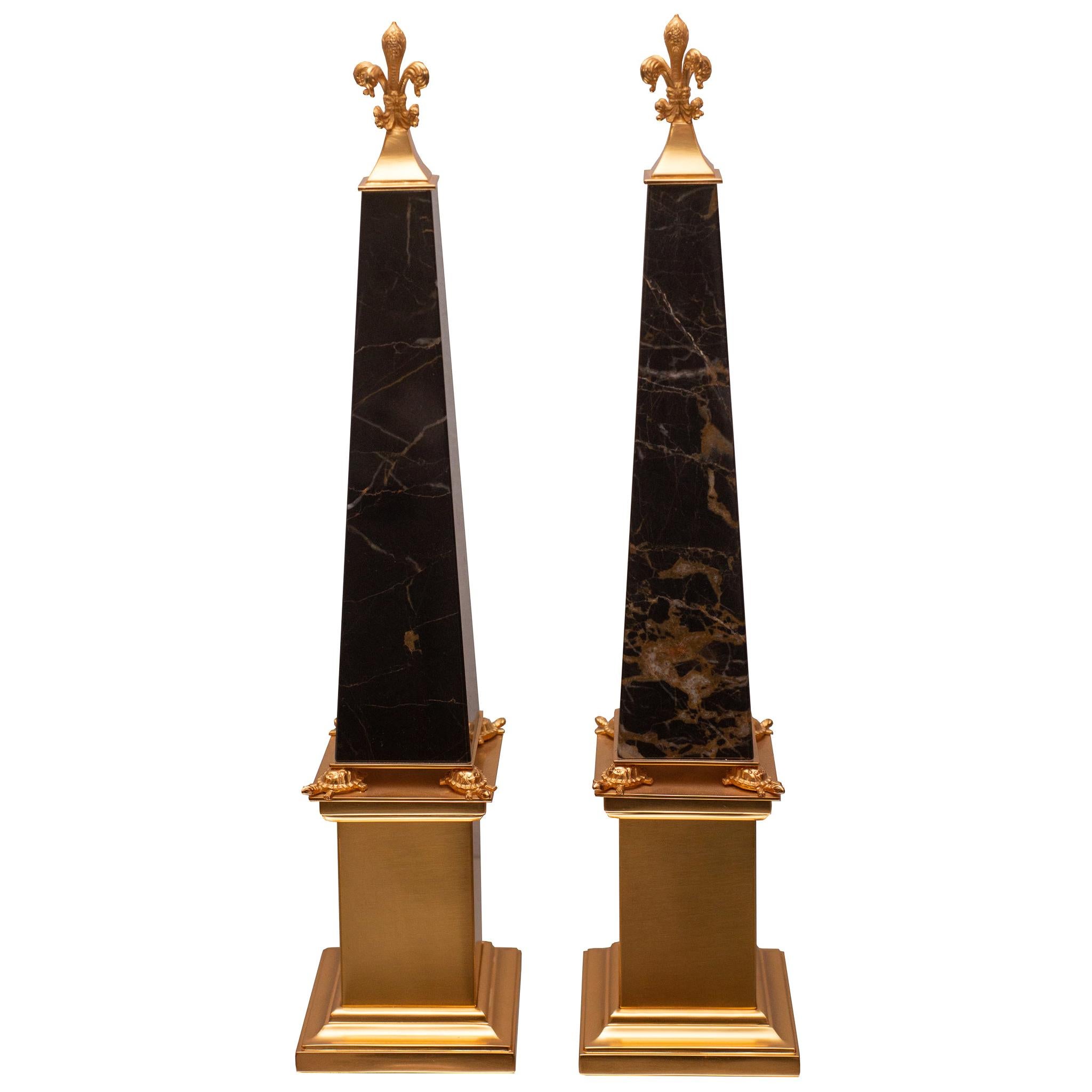 Contemporary Pair of Black & Gold St. Laurent Marble and Bronze Obelisks