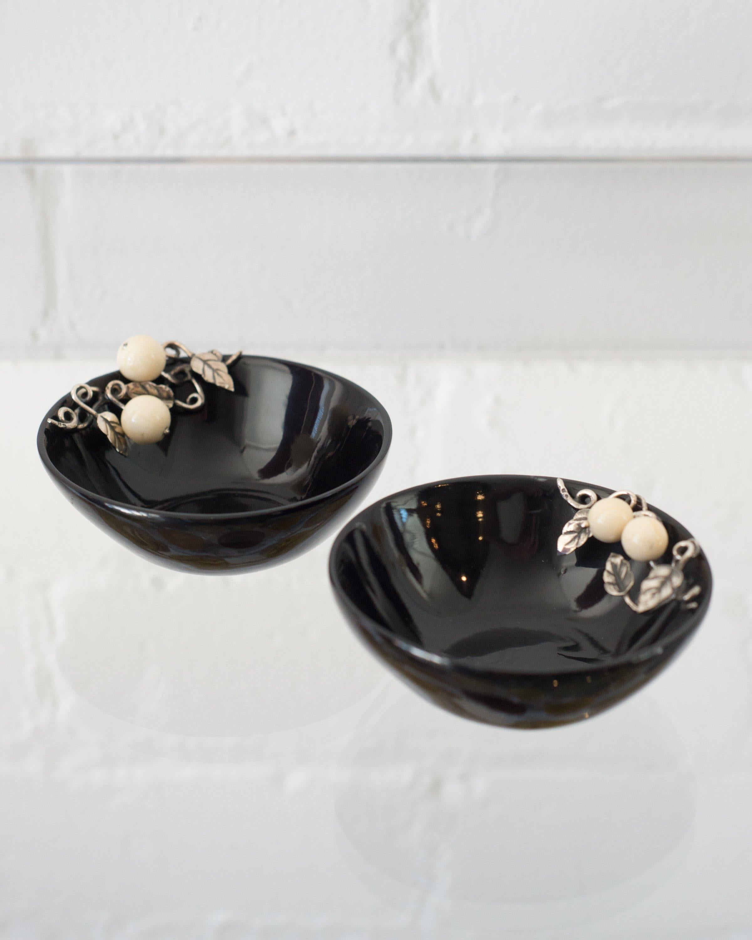 A pair of black horn bowls with 925 sterling silver leaves and white agate berries by a master jeweller. Made in Porto, Portugal.