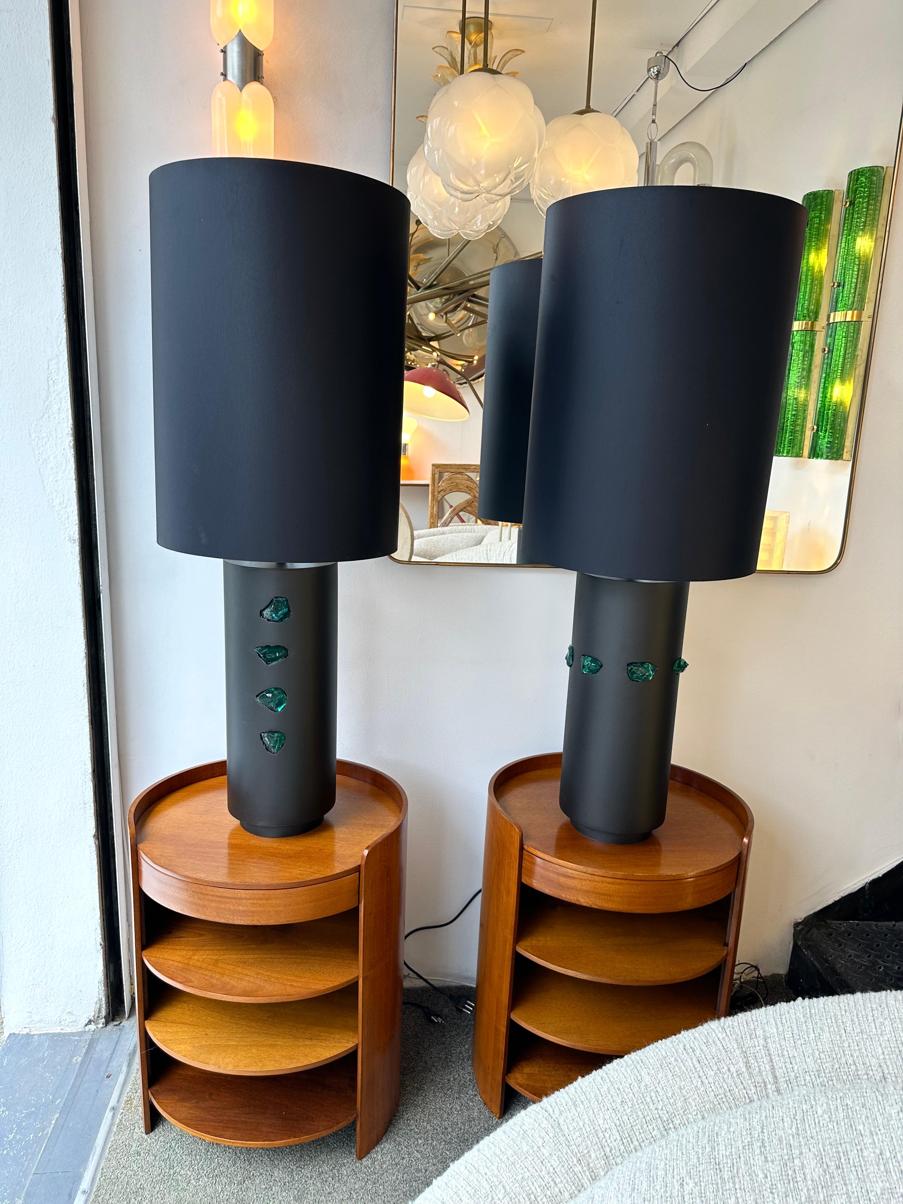 Large Pair of table or bedside black metal and green slag cut glass rock cabochon. In a Mid-Century Modern Space Age Hollywood Regency mood. In the style of Fontana Arte, Cristal Art, Esperia, Stilnovo, Arteluce.

Measurements lamps only H58 x W20 x