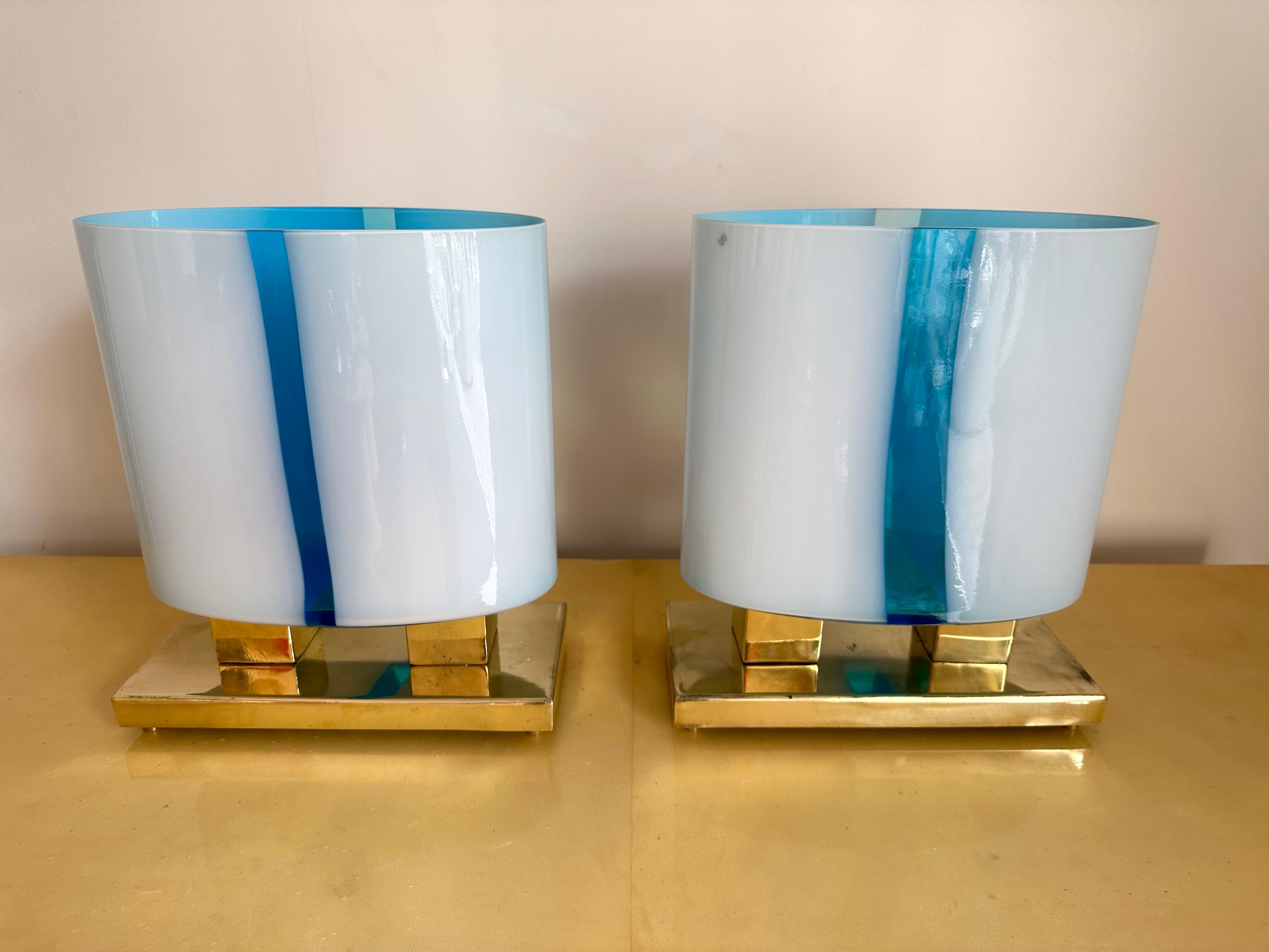 Pair of table or bedside brass lamps and blue Murano glass. Contemporary work from a small italian artisanal workshop in a Mid-Century Modern Space Age mood. Made with old stock of glass from the italian design manufacture Vistosi.