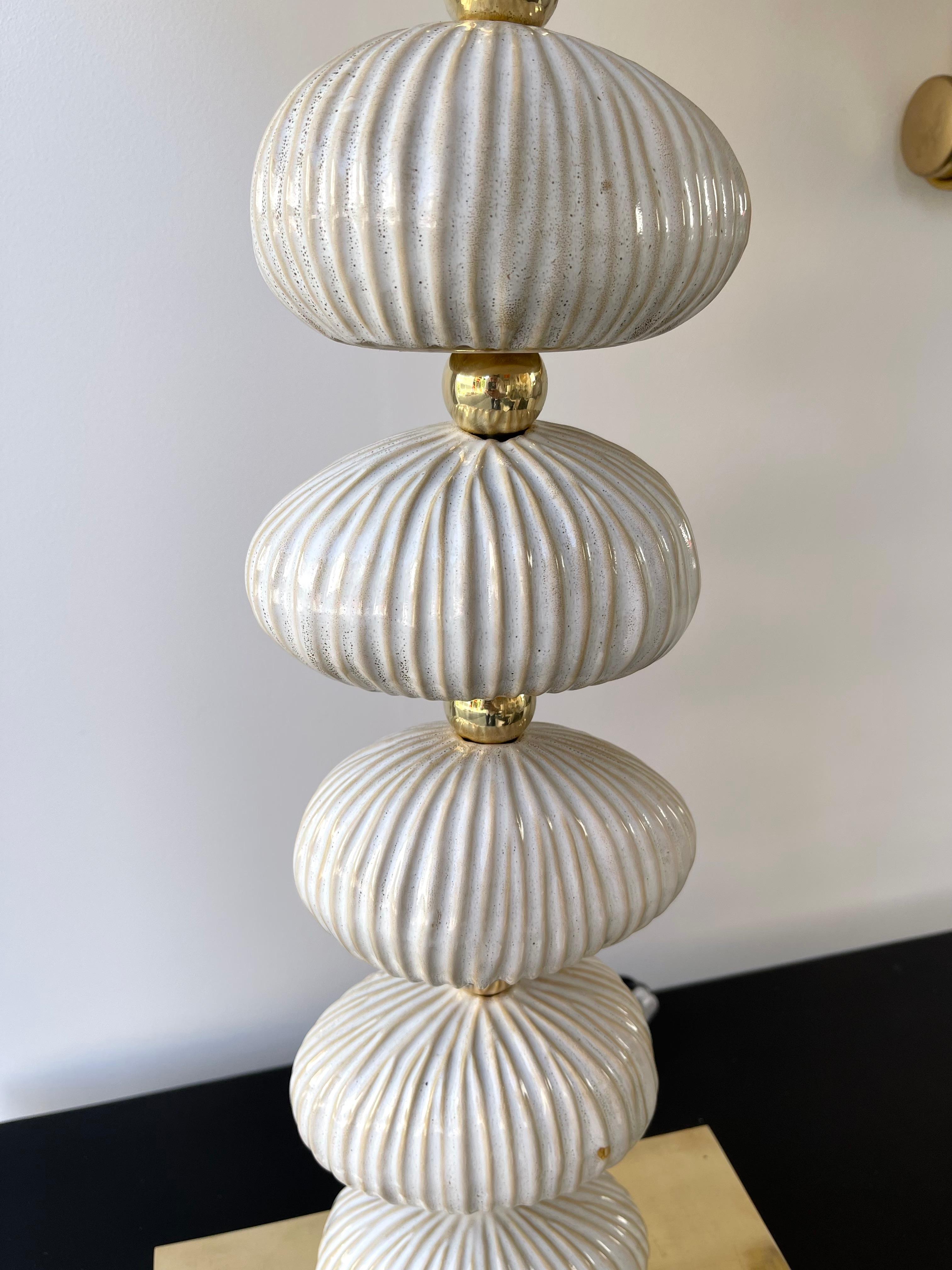 Pair of natural color and shape ceramic terracotta in the mood of sea shell fossil and brass table or bedside lamps. Contemporary work from a small artisanal italian design workshop.

Measurements indicated in description with demo shades
Demo