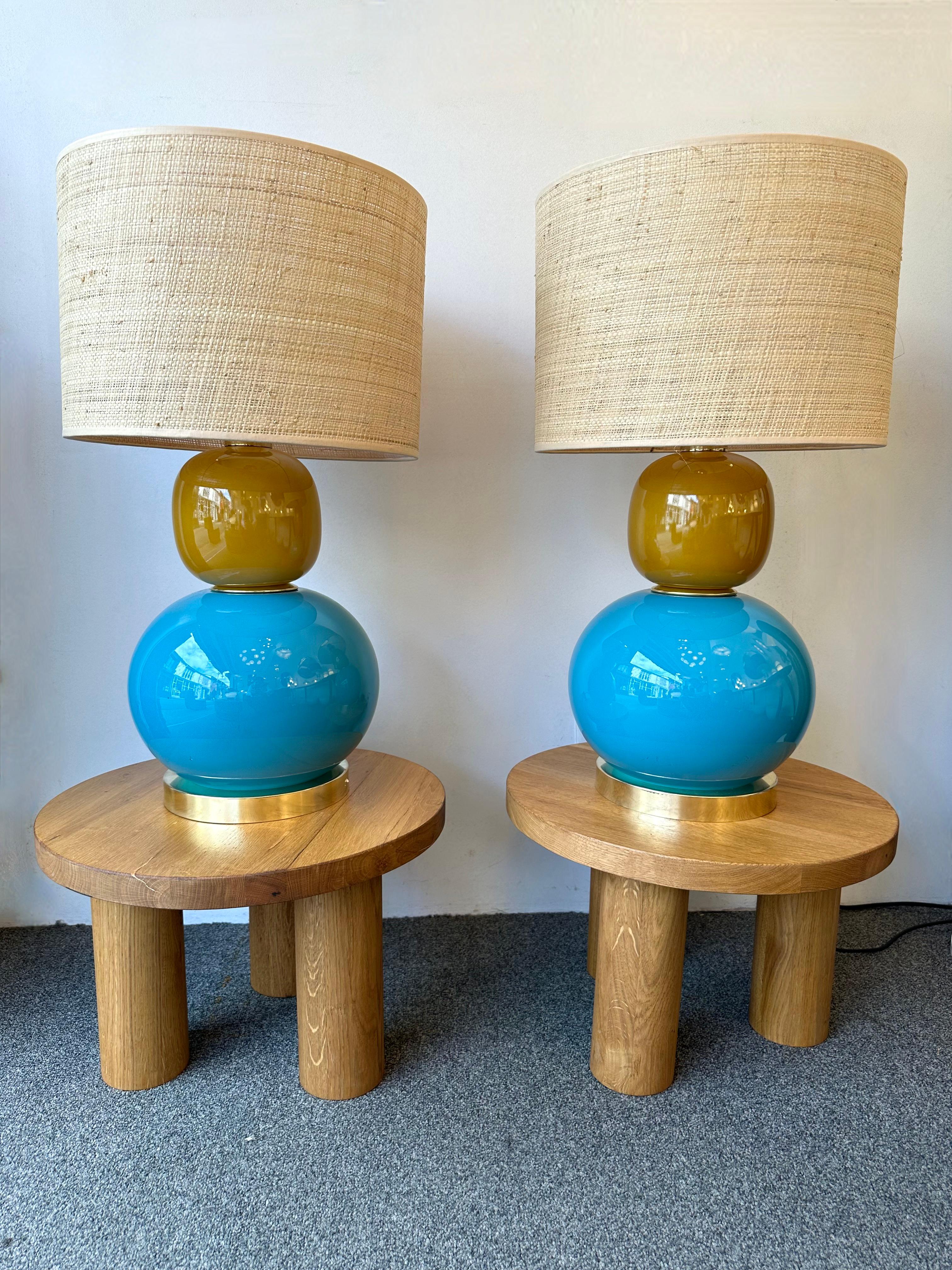 Pair of table or bedside brass lamps and Murano glass. Contemporary work from a small italian artisanal workshop, minor imperfections due to handmade, in a Mid-Century Modern Space Age Hollywood Regency mood.

Demo shades are not
