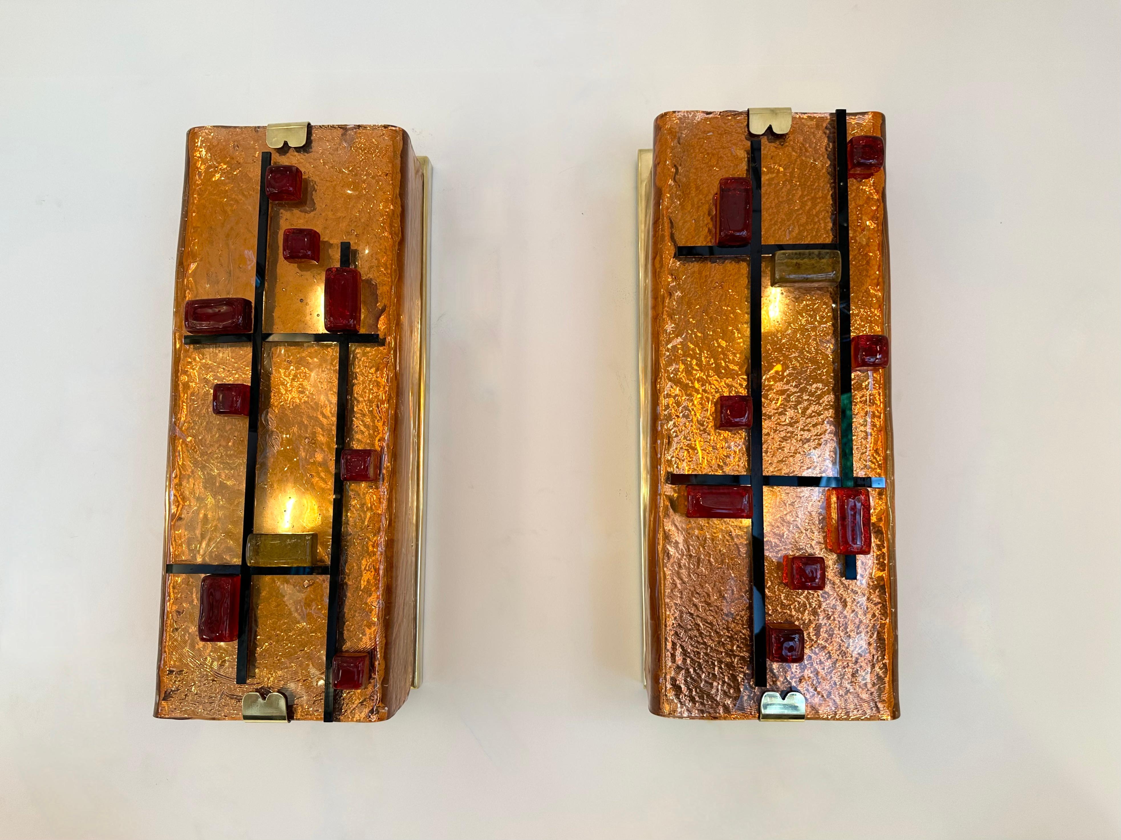 Pair of brass and coral, red and yellow cube details Murano glass wall lights lightning pannel lamps sconces. Contemporary work from a small artisanal italian design workshop. In the mood of Mid-Century Modern, Hollywood Regency palm tree, Venini,