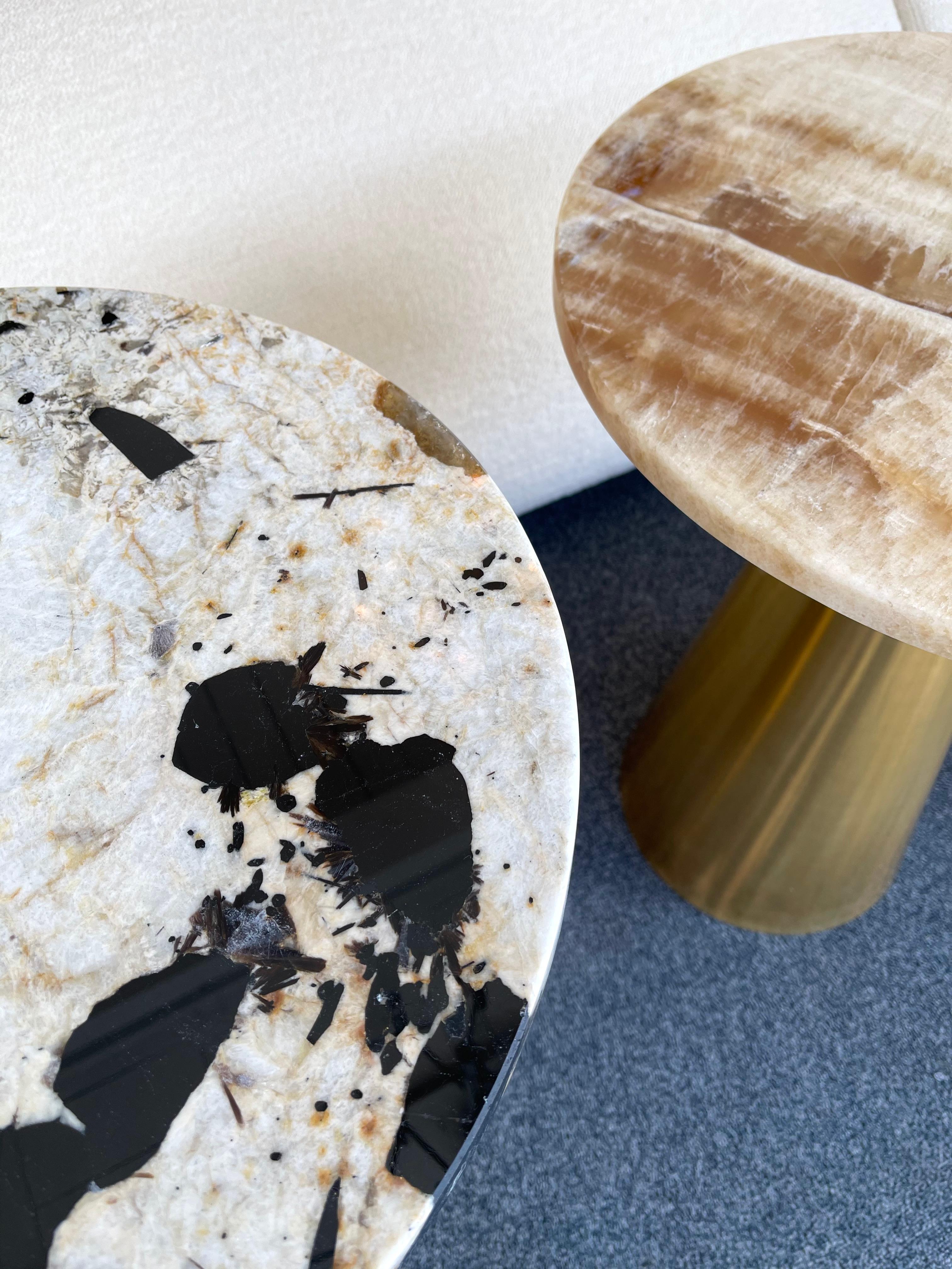 Contemporary pair of side end low coffee tables or nightstands in brass and marble. the marble are different but work well together.