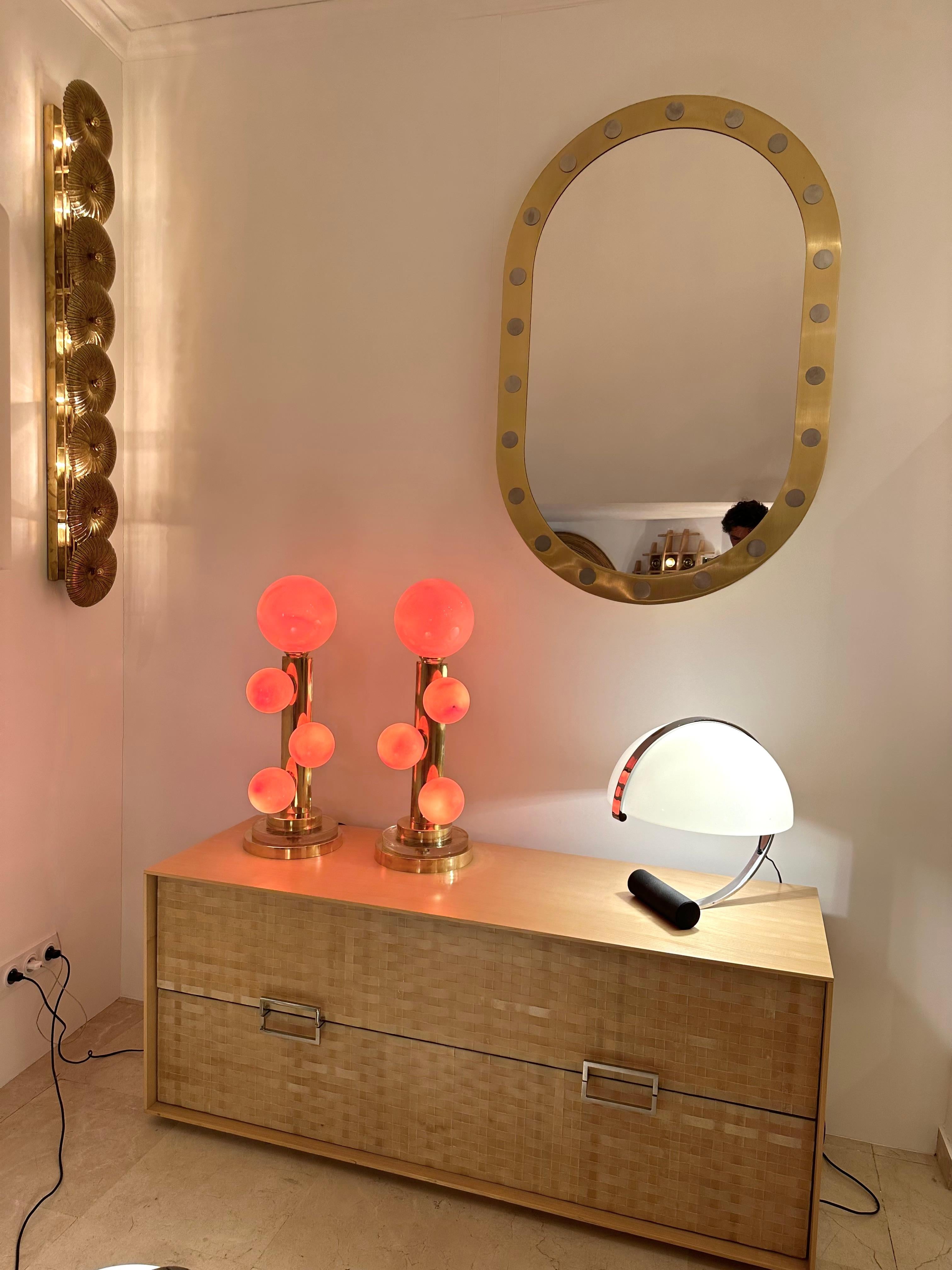 Pair of table or bedside brass lamps and big bubble gum pink Murano glass. Contemporary work from a small italian artisanal workshop in a Mid-Century Modern Space Age Hollywood Regency mood.
