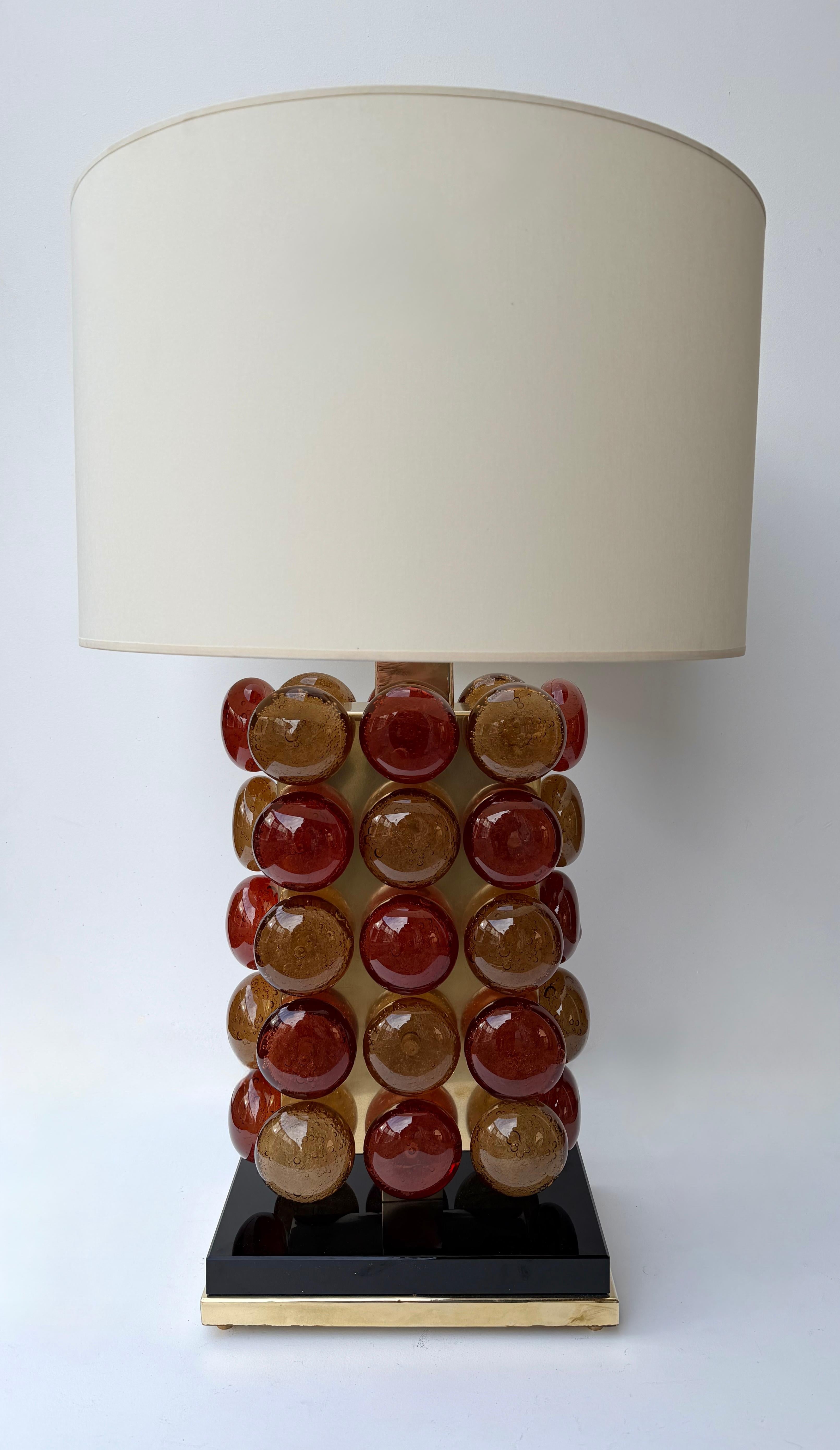 Pair of table or bedside Macaroons lamps in brass and Murano glass. Contemporary work from a small italian design artisanal workshop, minor imperfections due to artisanal handmade. in a Mid-Century Modern Space Age Hollywood Regency mood, Carlo