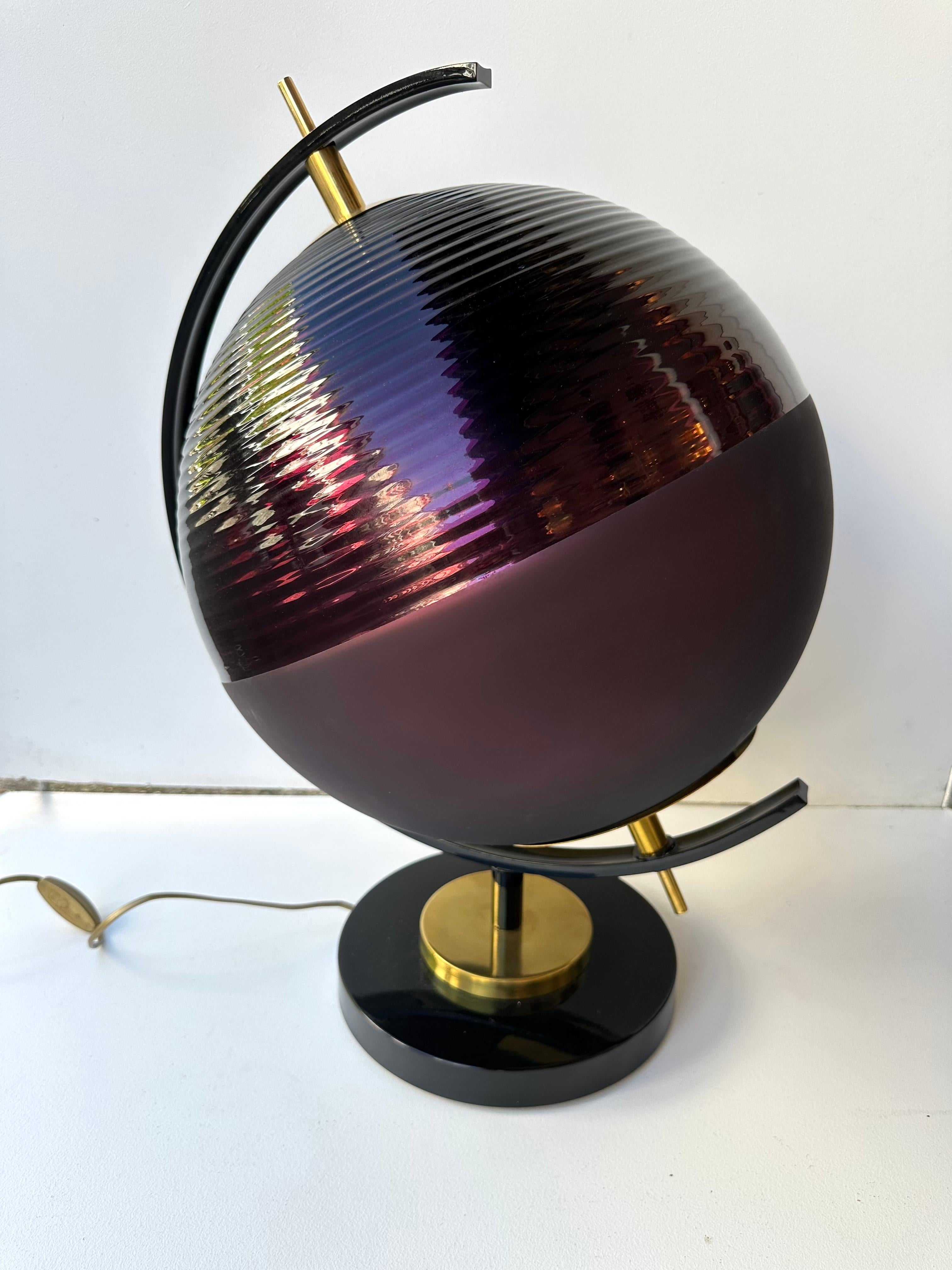 Pair of table or bedside World Map style lamps in brass and purple Murano glass, black lacquered base. Contemporary work from a small italian artisanal workshop, minor imperfections due to artisanal handmade. in a Mid-Century Modern Space Age