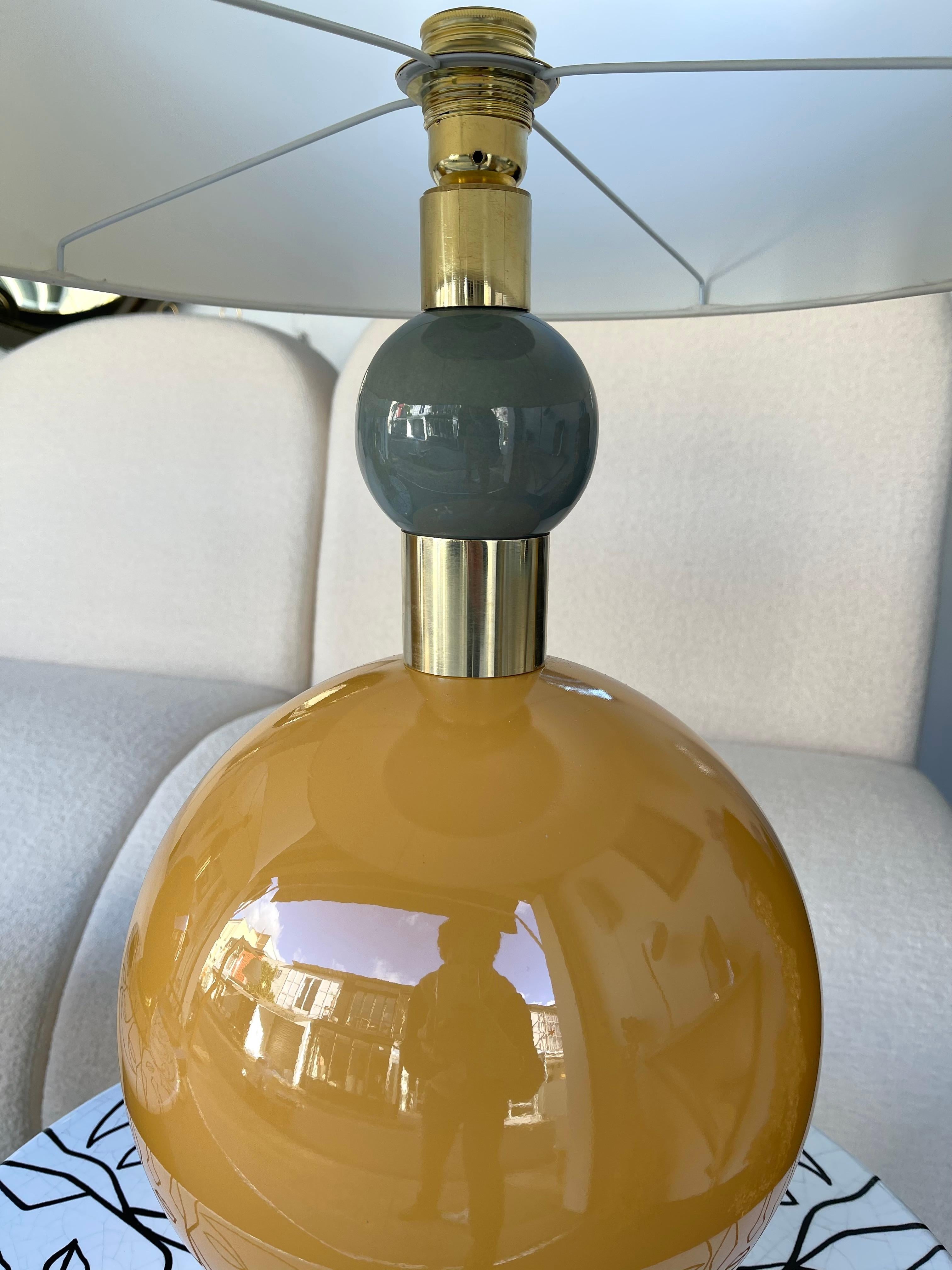 Pair of table or bedside brass lamps orange and gray Murano glass ball. Contemporary work from a small italian artisanal workshop.

Demo shades non included. Measurements in description with demo shades
Measurements lamp only H59 x W29 x D29 cms.