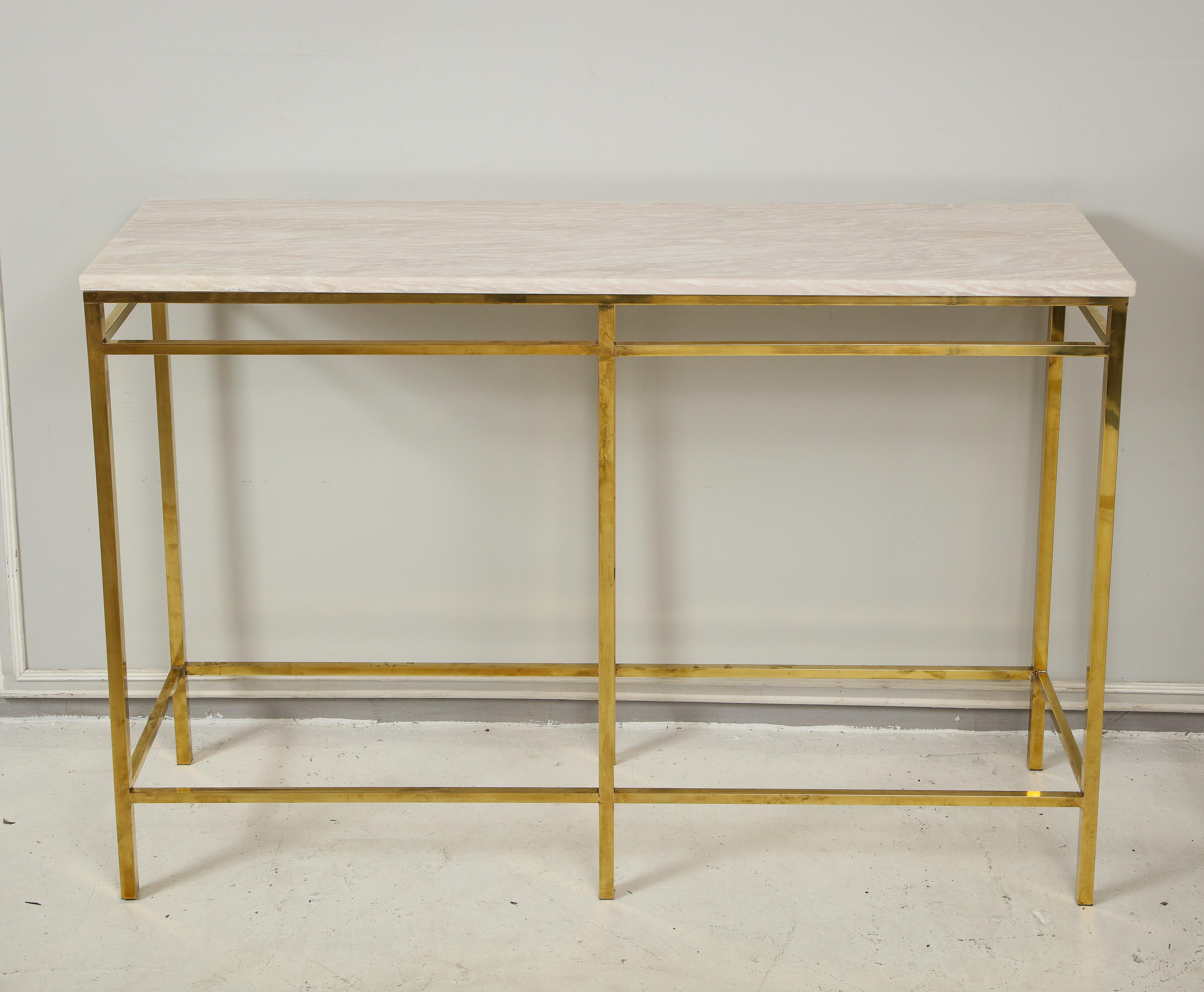 Contemporary pair of brass consoles with onyx tops.