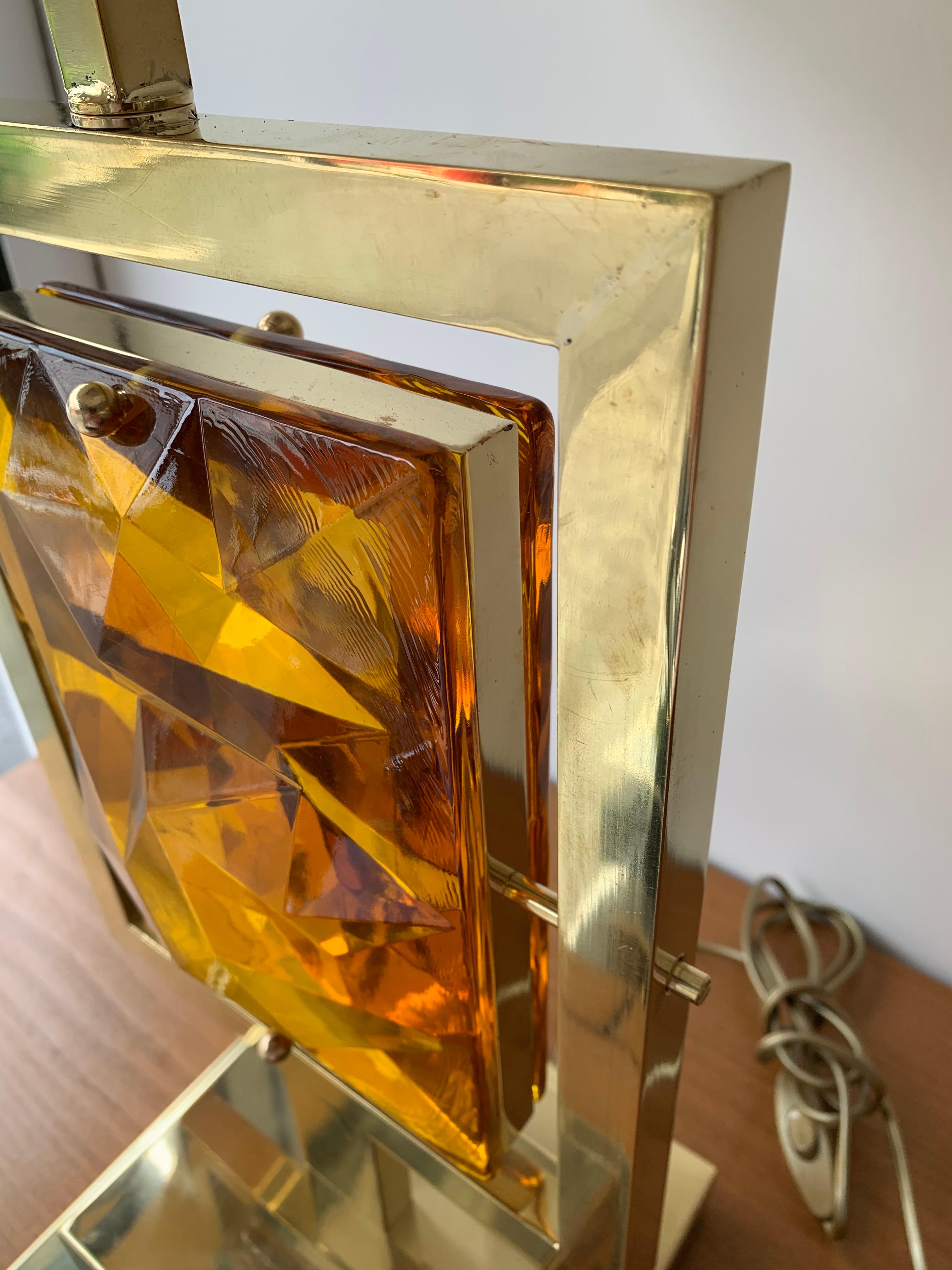 Pair of brass and faceted amber topaz Murano glass table lamps. Contemporary work small Italian Murano workshop. 

To note: demonstration shades not included. Measurements indicated without shades. Height with demonstration 77.5 cms.