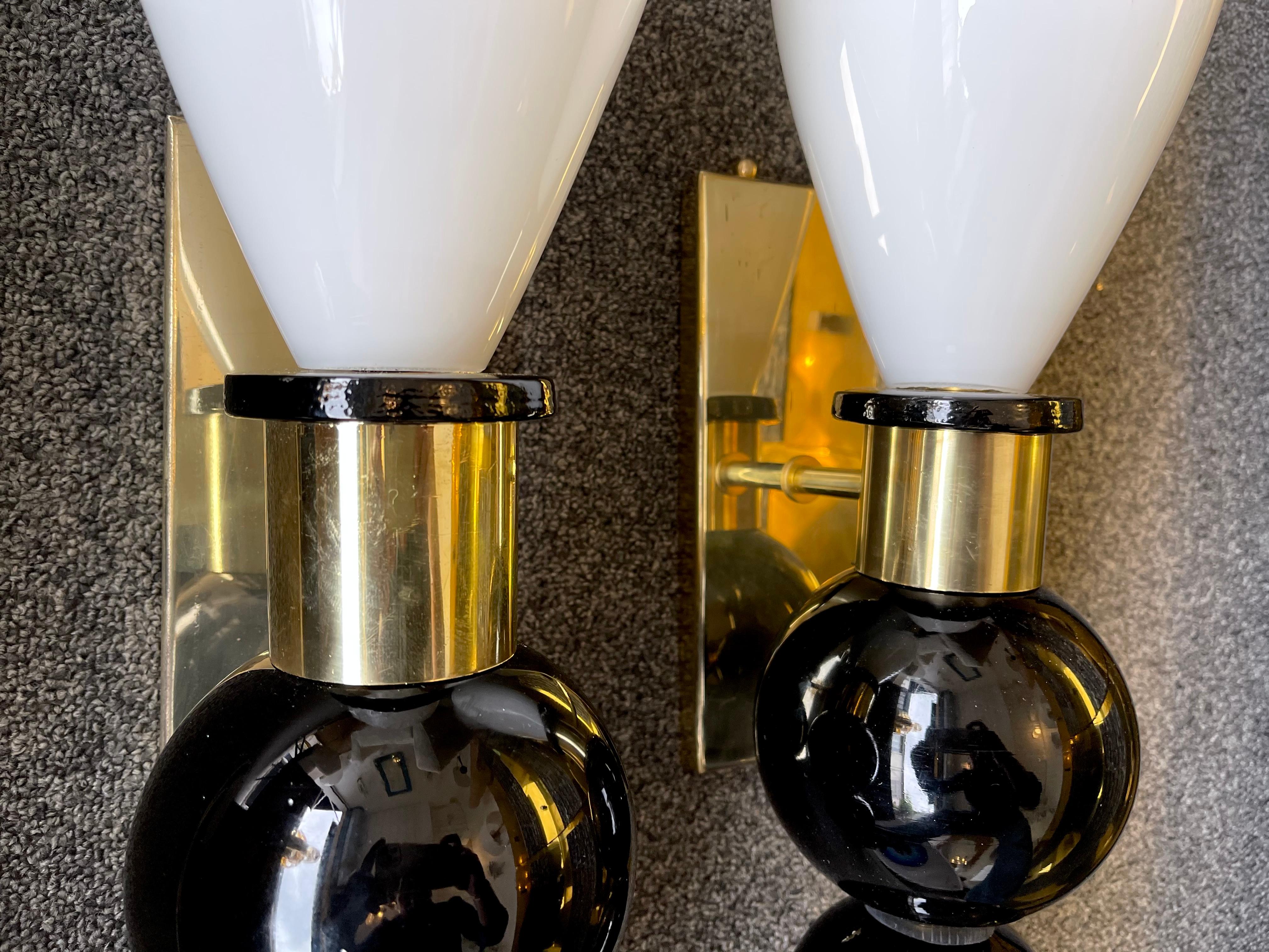 Pair of wall lights lamps sconces in brass and black and white Murano Glass. Small artisanal production from an italian workshop.