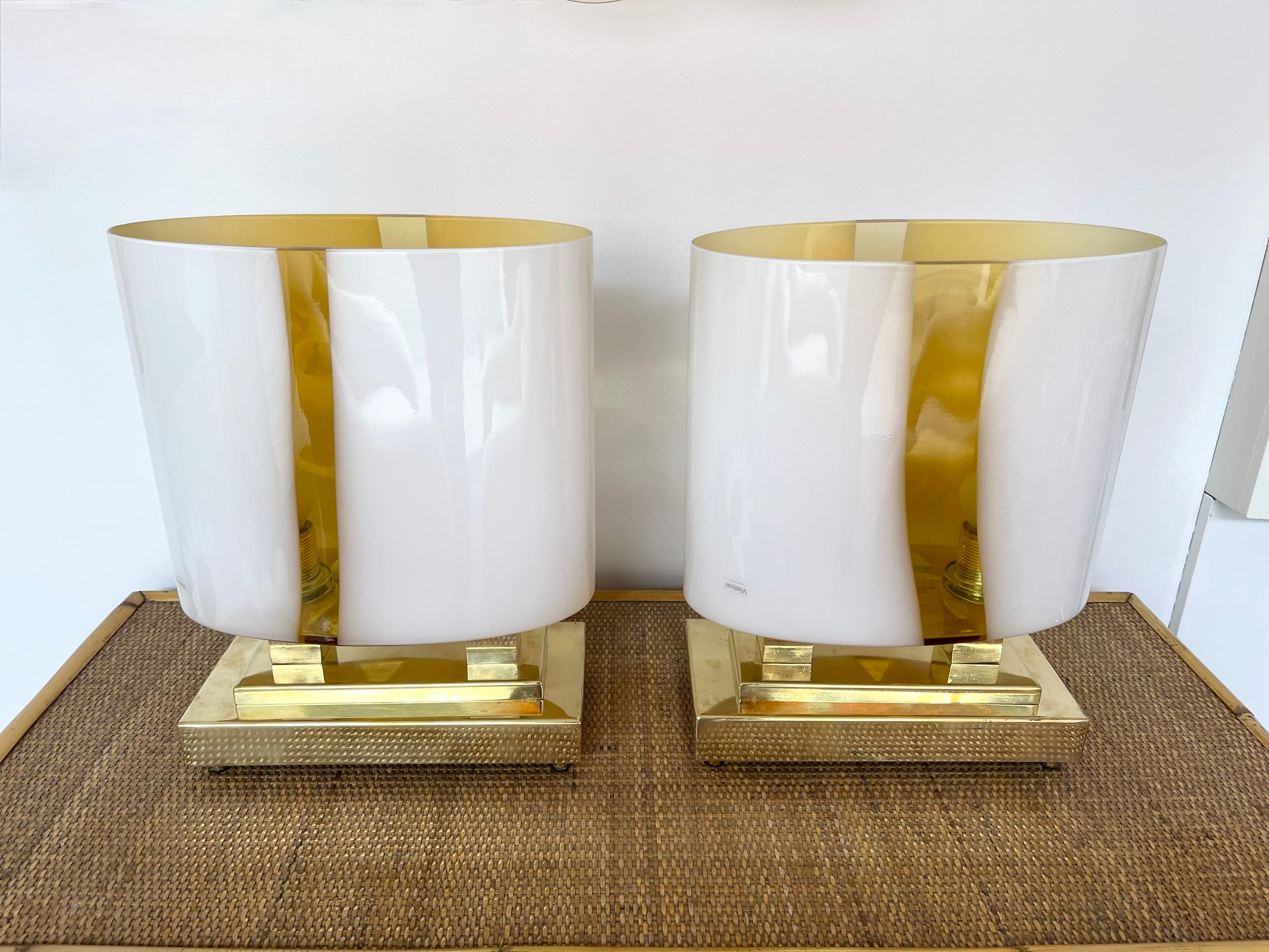 Pair of table or bedside brass lamps and Murano glass. Made with old stock of glass from the manufacture Vistosi. High quality glass, original stamp from the manufacture. Contemporary work from a small italian artisanal workshop. In the mood of