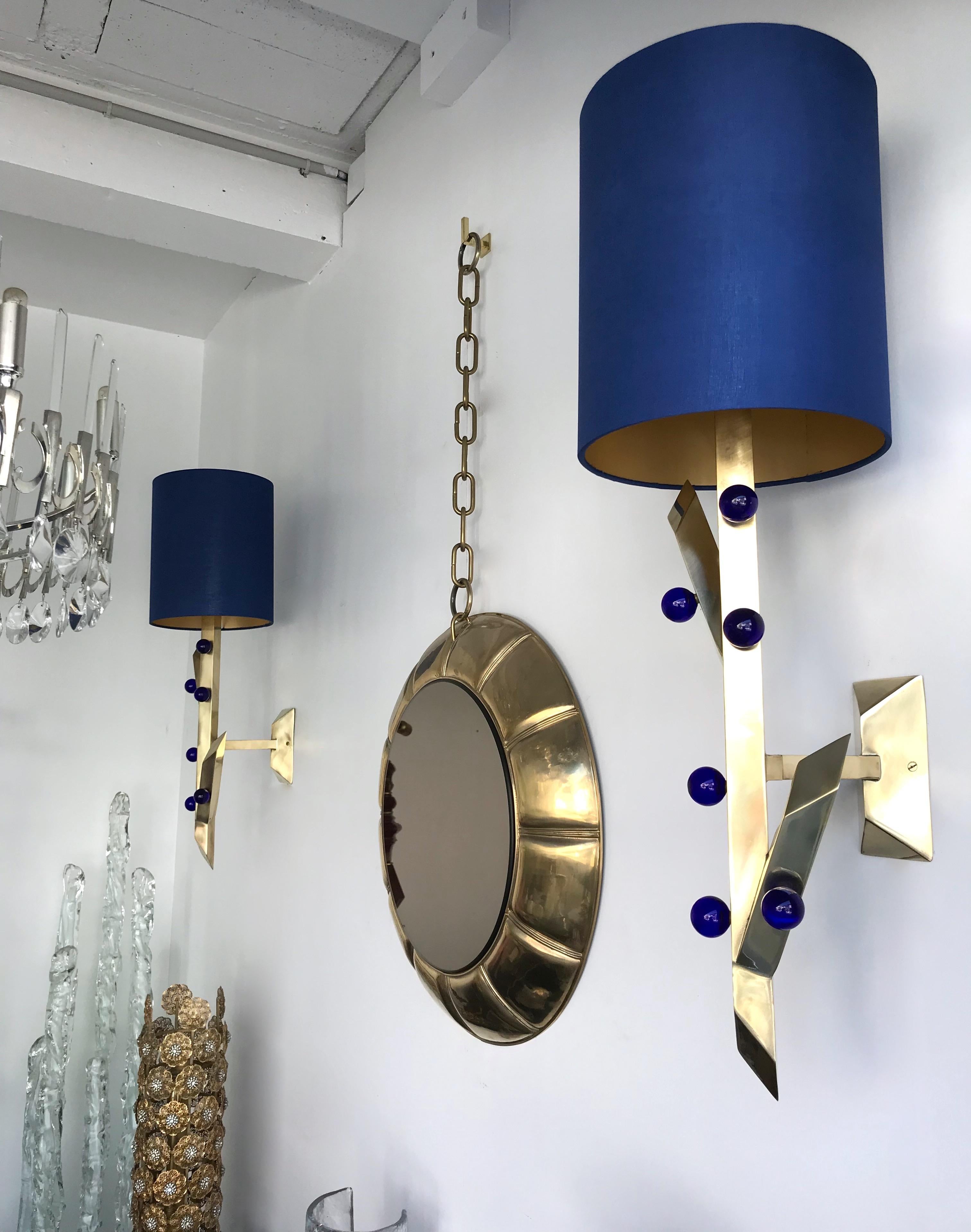Very decorative contemporary pair of brass and Blue Murano glass ball sconces. Plant style. Minor imperfections on shades. The shades are always included. Small artisanal production from an Italian workshop.