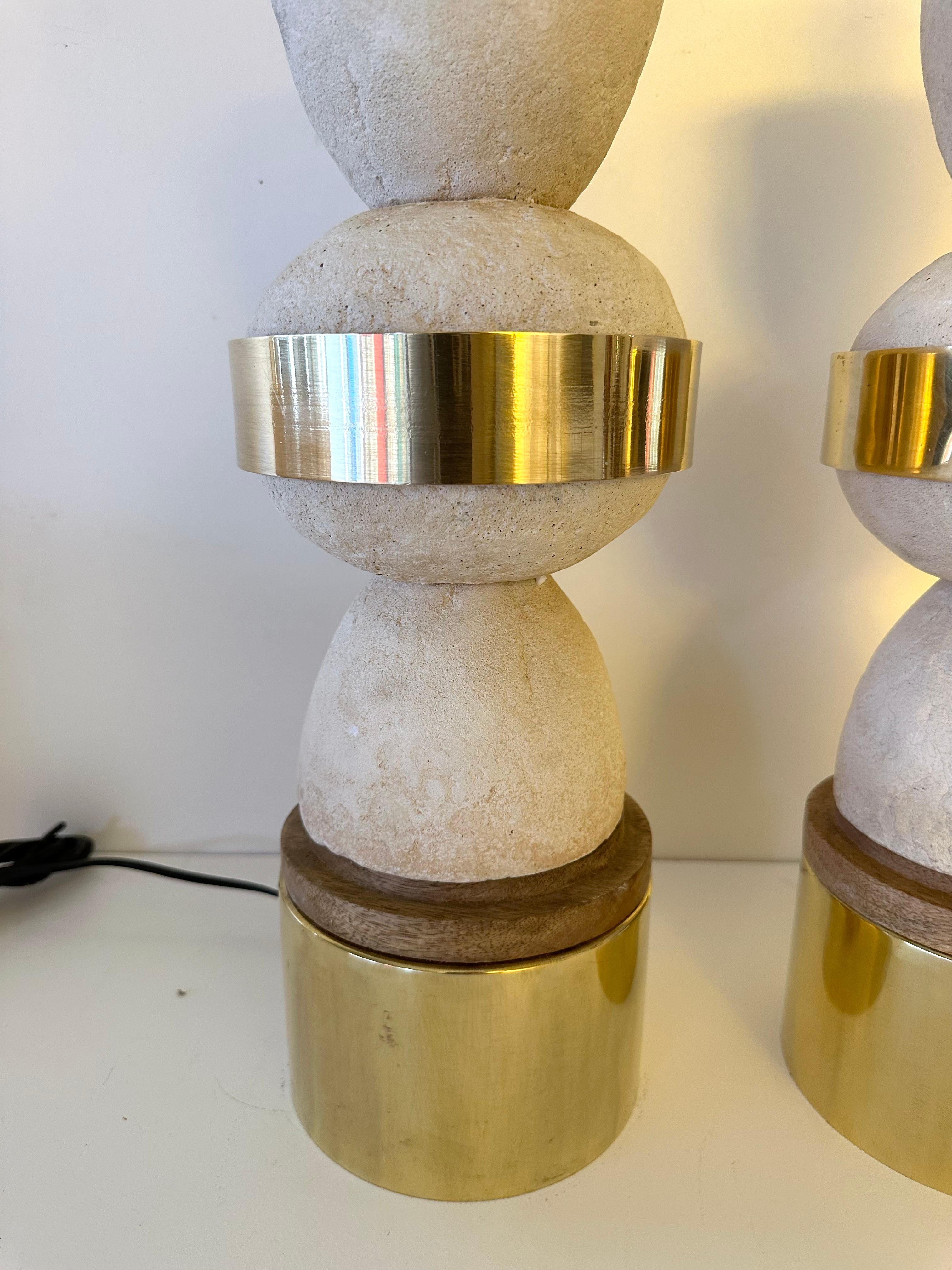 Pair of table or bedside brass and white concrete cast stone style with wood details lamps. Contemporary work from a small italian artisanal design workshop, minor imperfections due to handmade, in a brutalist, Mid-Century Modern, Space Age,