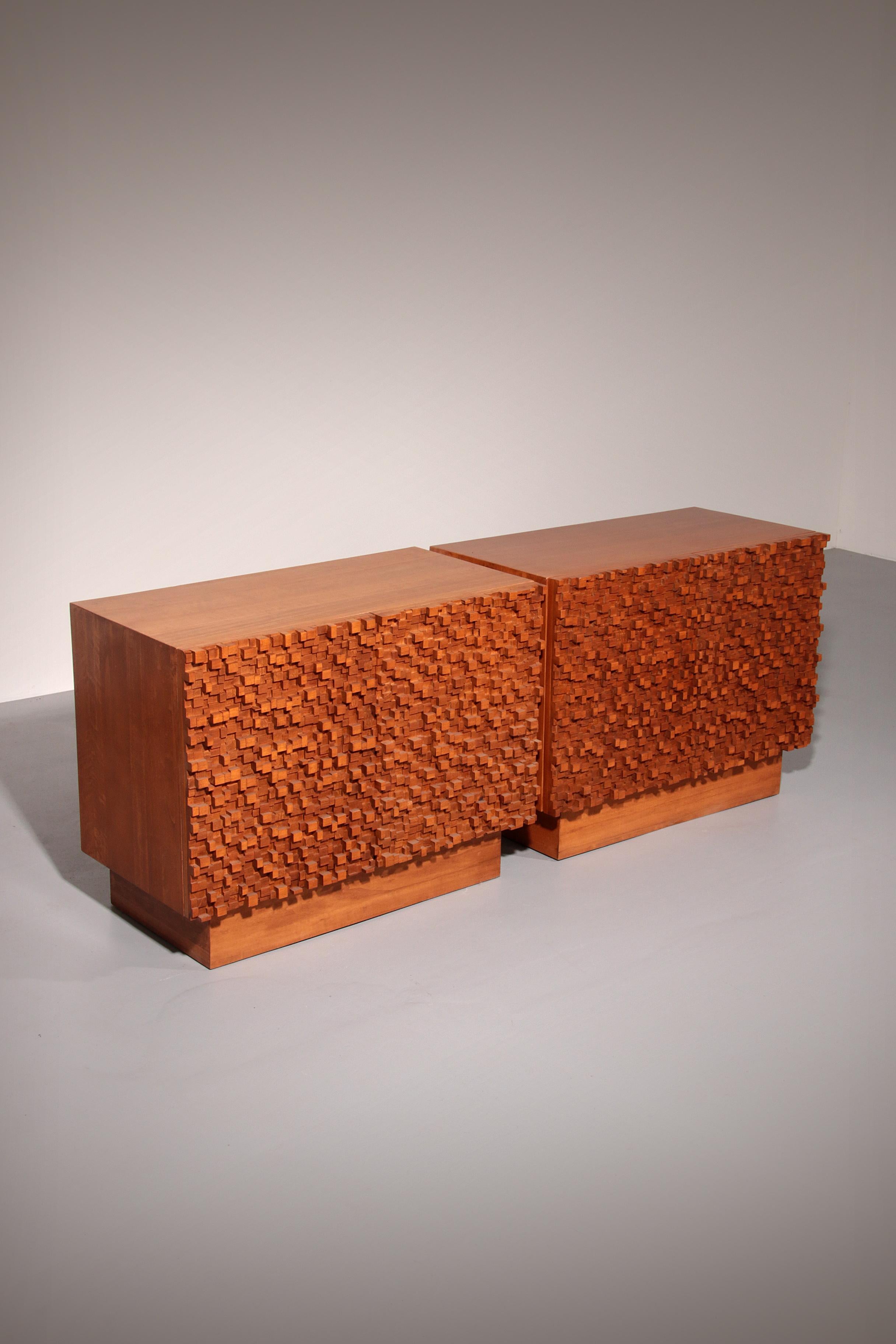 Elevate your living space with this striking pair of contemporary Italian sideboards, where artistry meets functionality. Crafted from rich wood, each sideboard features clean-lined, plinth-based bodies that exude modern sophisticationThese