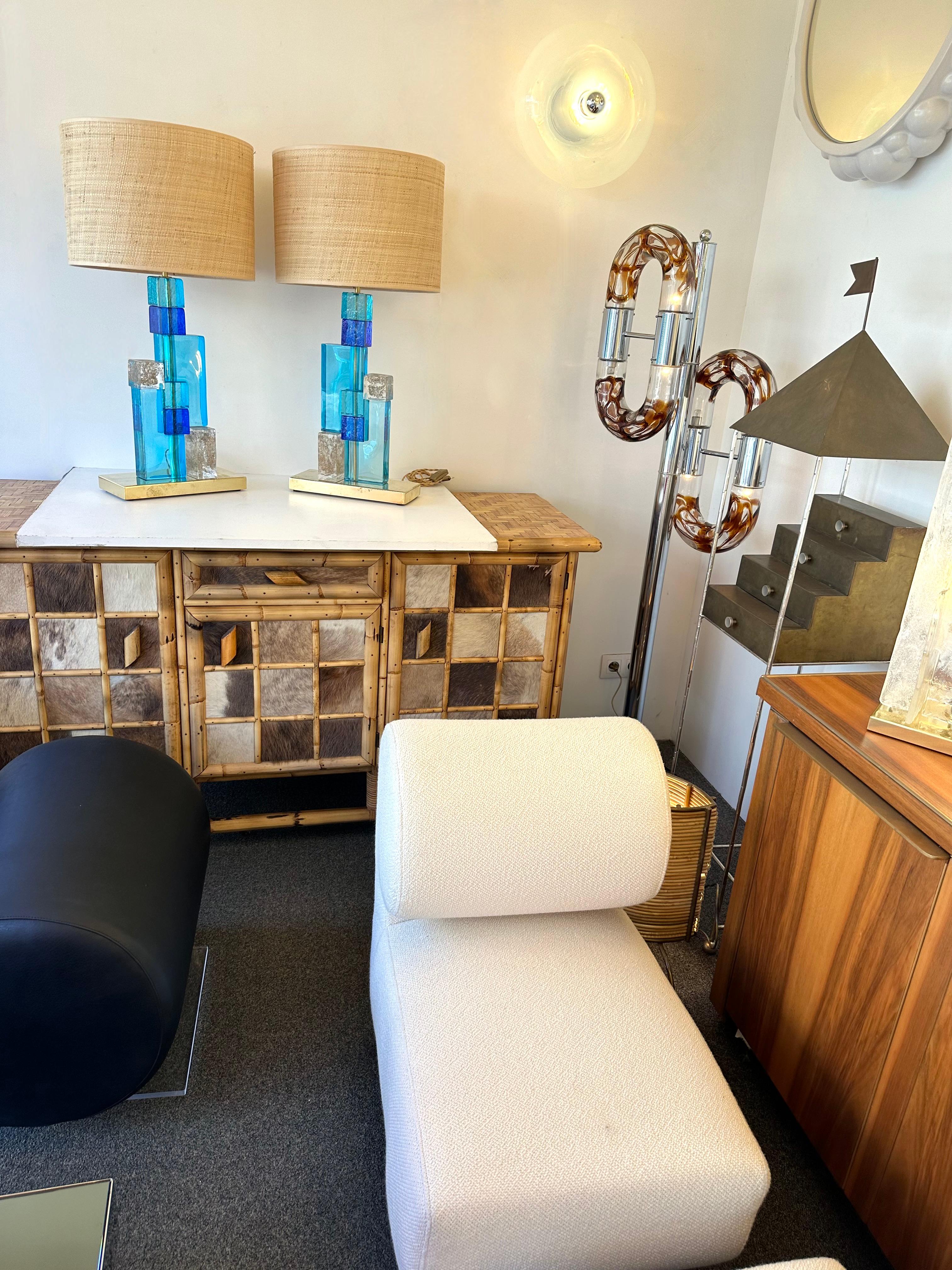Pair of contemporary table or bedside lamps cubic pressed blue, baby blue and gold leaf powder Murano glass block cube and brass base. Few exclusive artisanal production. In the style of Mazzega, Veronese, Poliarte, Venini, Vistosi, Carlo Aldo