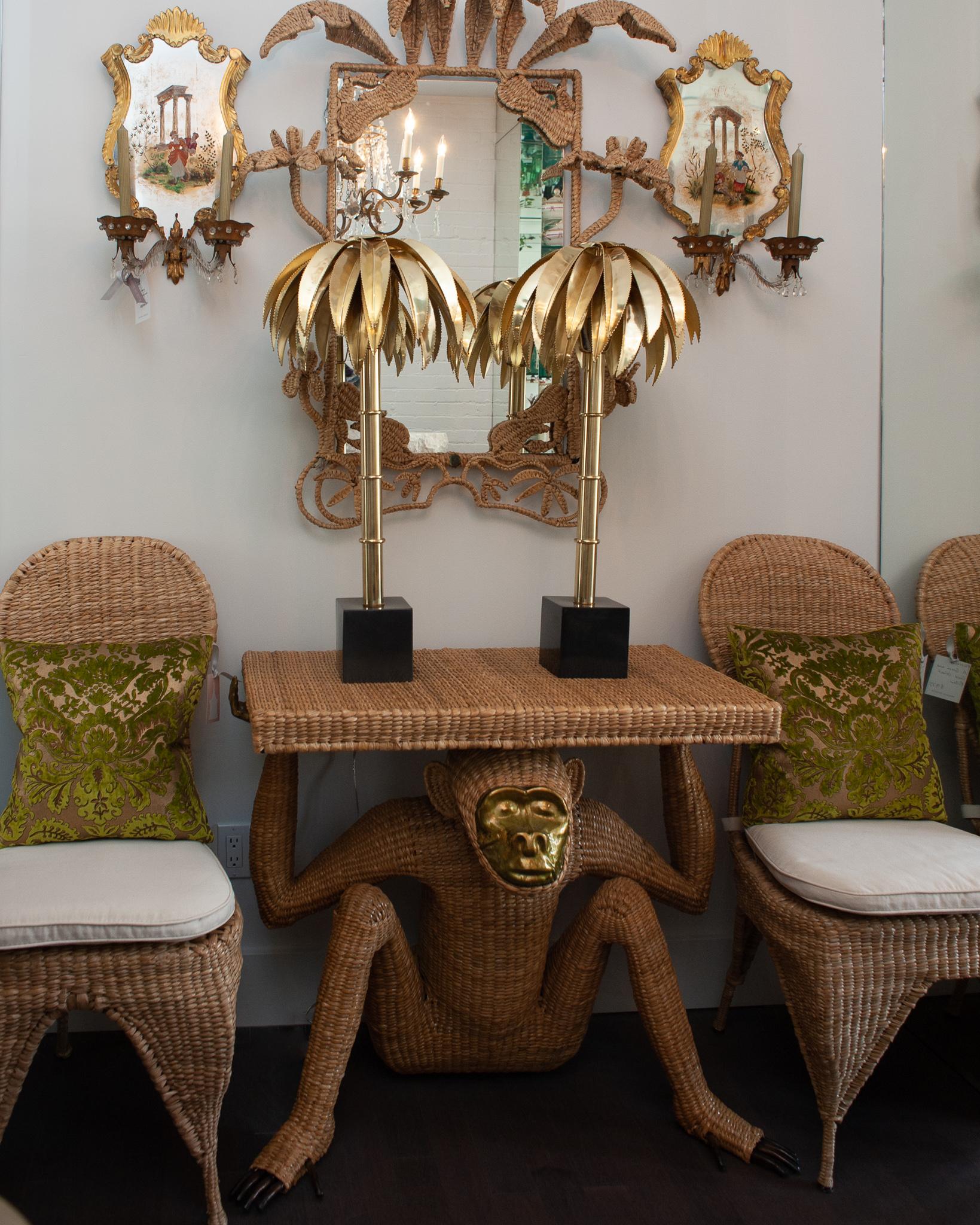 Mario Lopez Torres pair of balloon back chairs, constructed with a metal frame and expertly woven natural rattan. Sold with tonal beige seat cushions. Labeled with a brass medallion by Mario Lopez Torres Established 1974. 