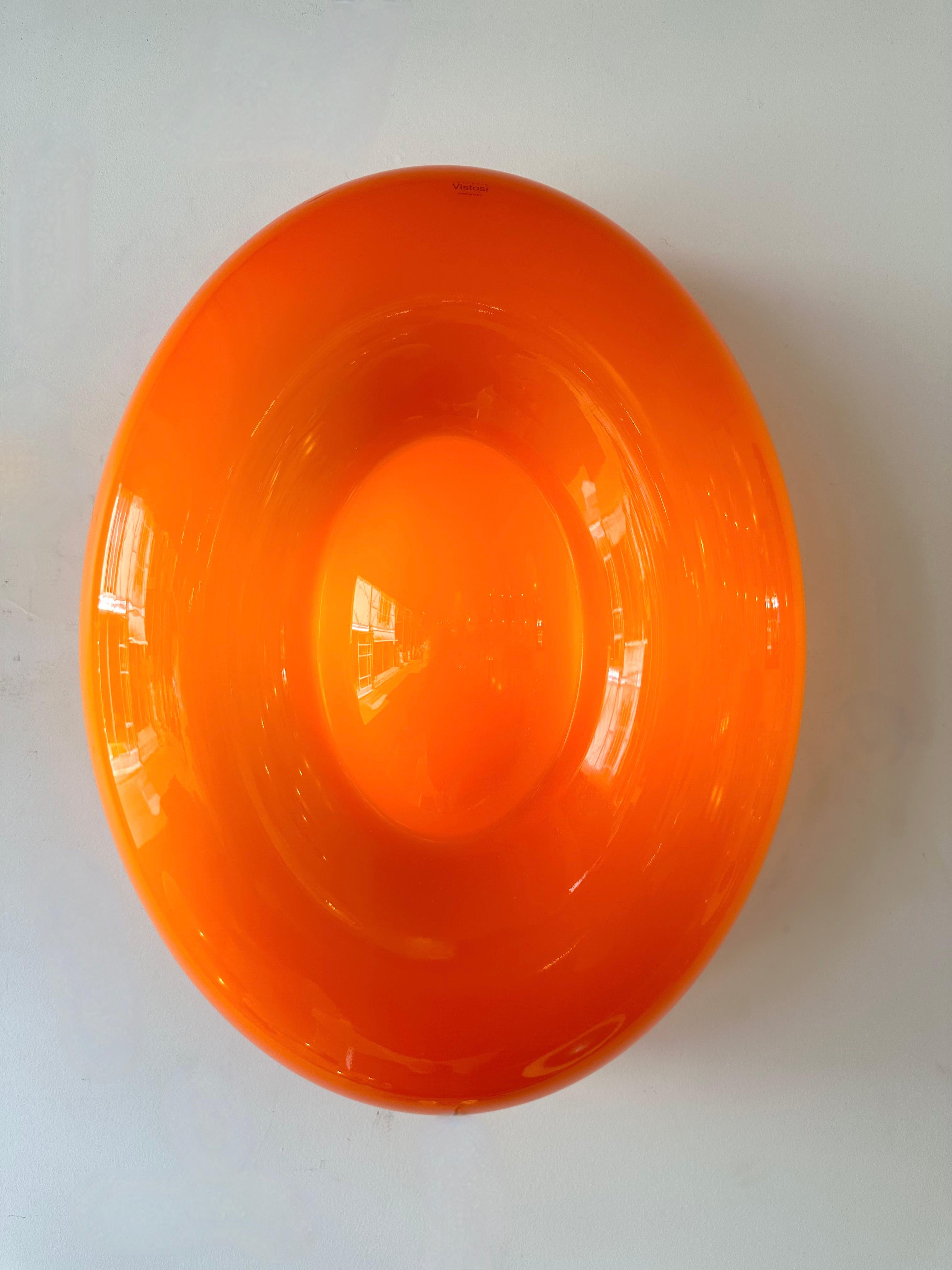 Contemporary Mid-Century Modern Space Age style Orange Murano glass Candy wall lamps lights lightning sconces. New old stock from the italian design Murano manufacture Vistosi circa 2010. Original editor stamps stickers tags on the glass. Famous