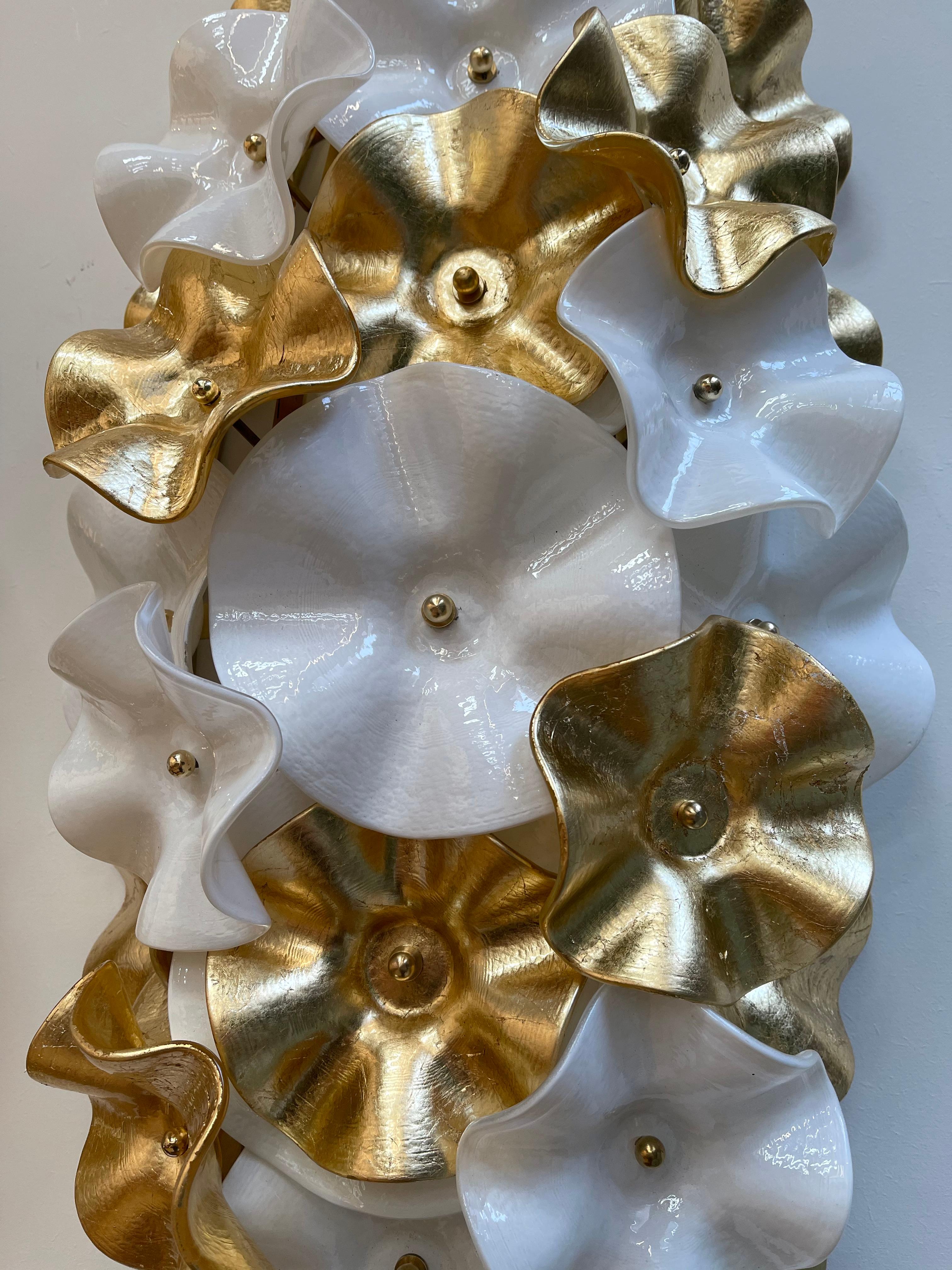 Large tall pair of flowers wall lights lamps sconces, gold leaf and white Murano glass, brass structure. Contemporary work from a small artisanal Murano workshop. In the mood of Venini, Vistosi, La Murrina, Seguso.