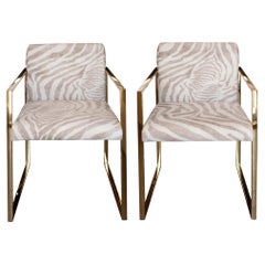 Contemporary Pair of Polished Brass and Zebra-Print Fabric Upholstered Armchairs