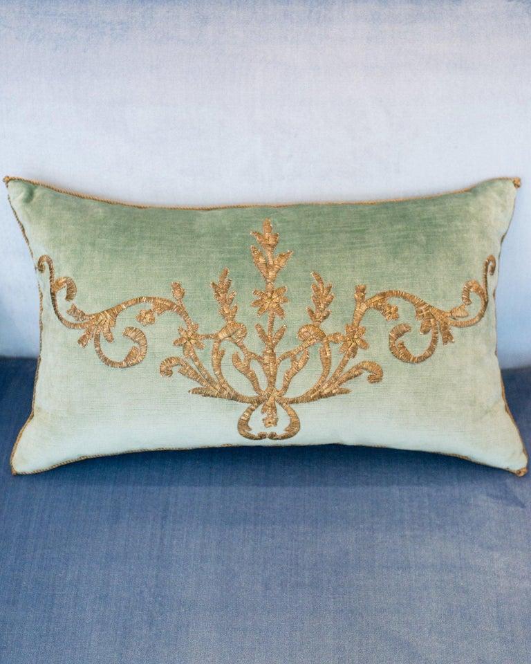 A stunning pair of Rebecca Vizard pillows with Antique Ottoman Empire raised metallic embroidery, hand stitched on aqua velvet.
Rebecca Vizard is a renowned textile designer and founder of B. Viz Design, celebrated for transforming rare antique