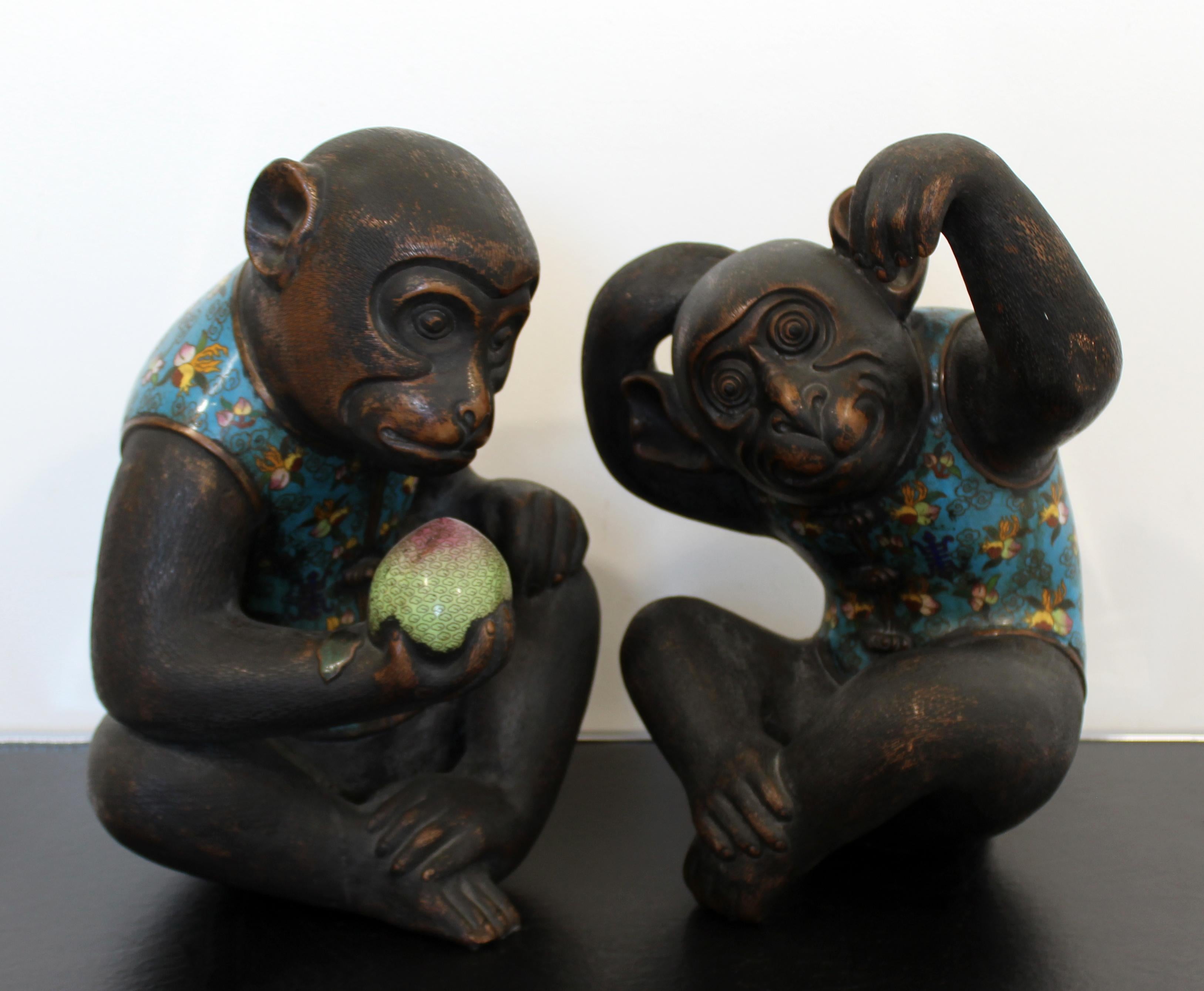 For your consideration is a fantastic pair of metal cloisonné table sculptures, of two monkeys in chinoiserie vests, by Robert Kuo. In excellent condition. The dimensions are 11