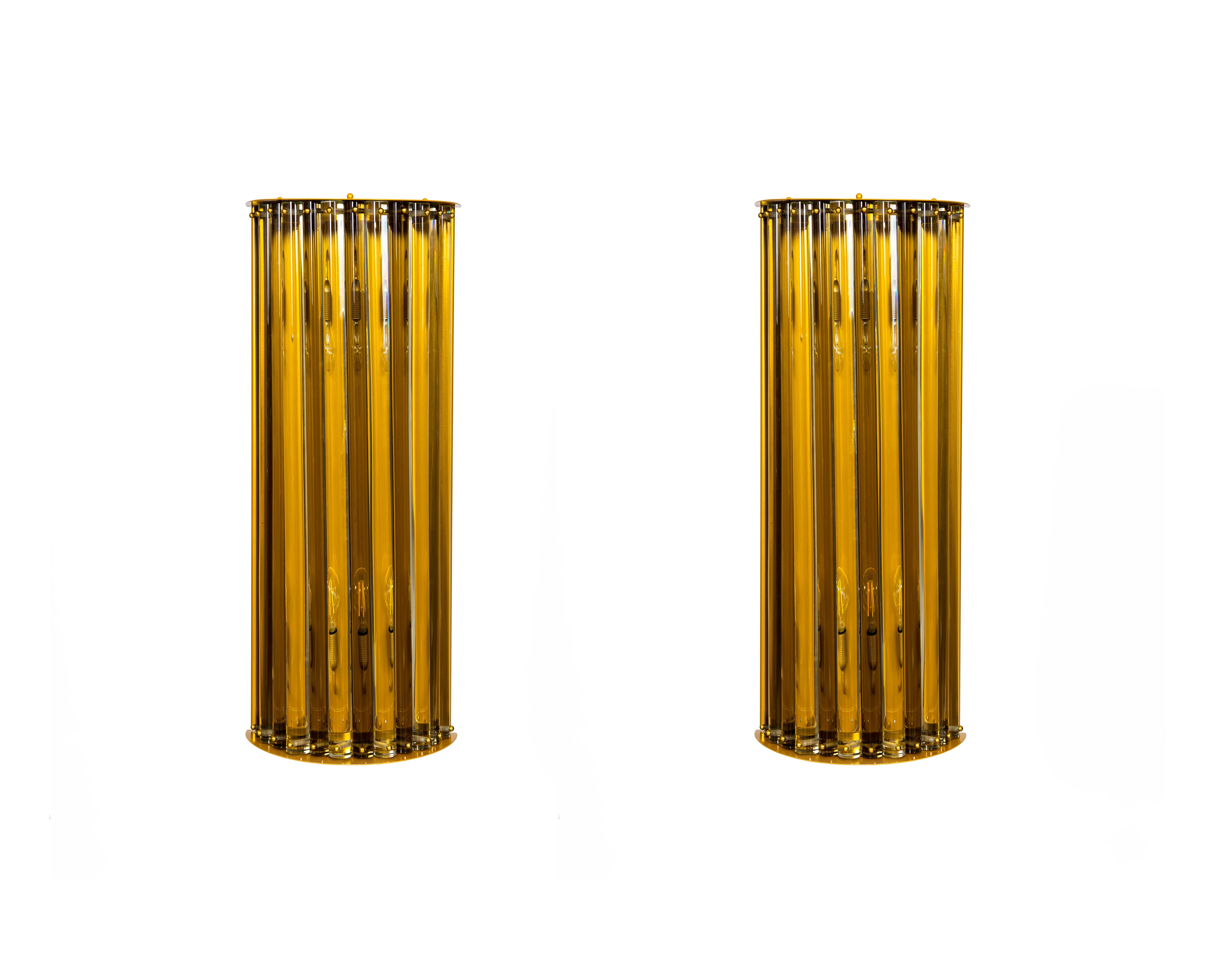 Pair of Murano Glass wall Lights Straw-Colored by Giovanni dalla Fina, contemporary.
This is a fantastic pair of sconces entirely handcrafted in blown Murano glass, designed and manufactured by the Italian artist and designer Giovanni Dalla Fina.