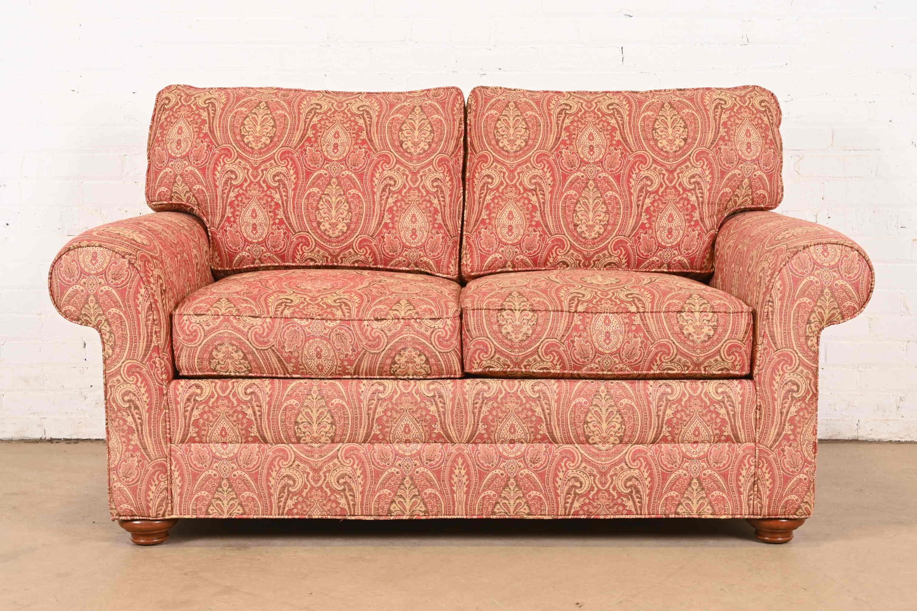A gorgeous contemporary loveseat in paisley upholstery with down and feather blend cushions

USA, Early 21st Century

Measures: 64