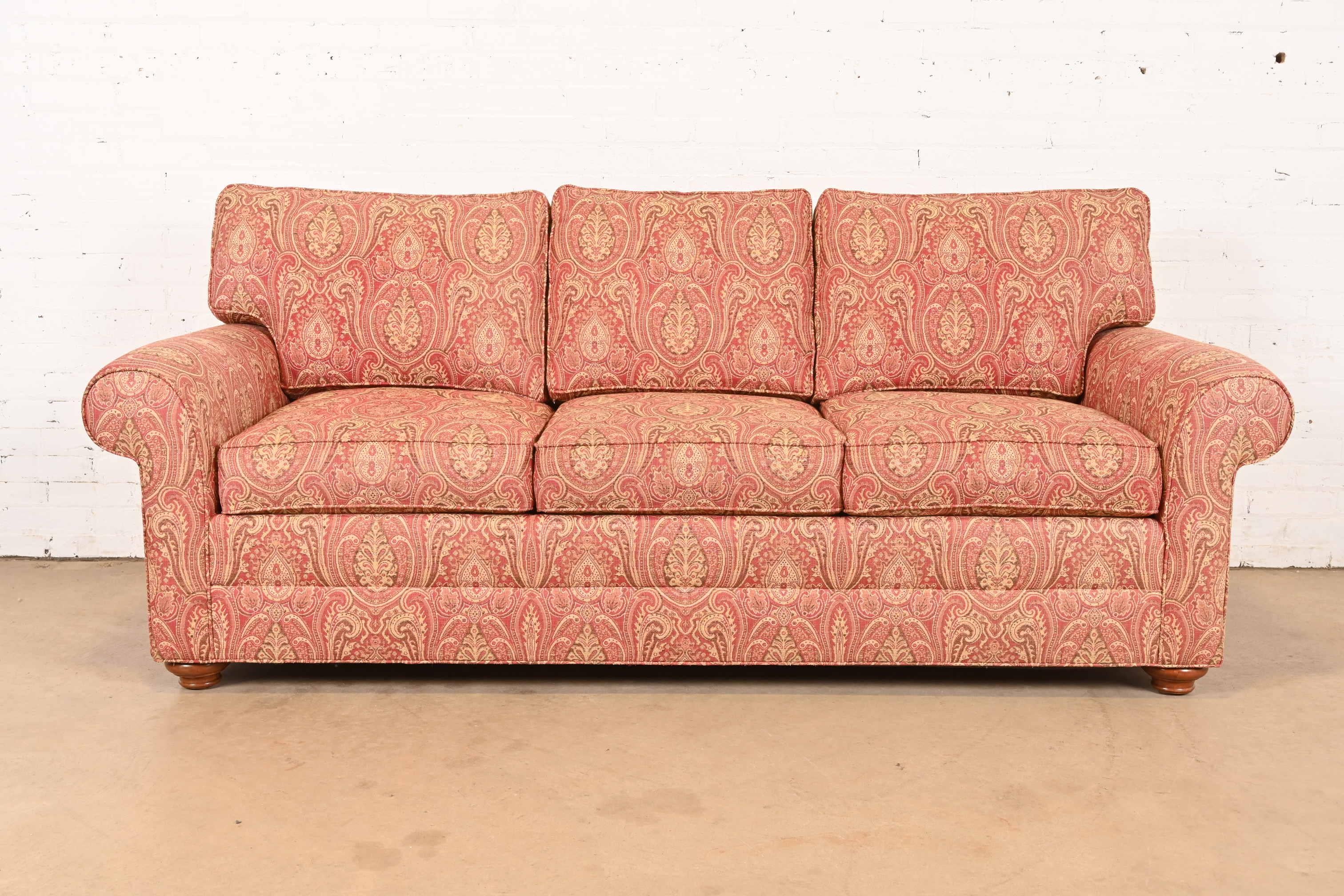 A gorgeous contemporary sofa in paisley upholstery with down and feather blend cushions

USA, Early 21st Century

Measures: 87.5