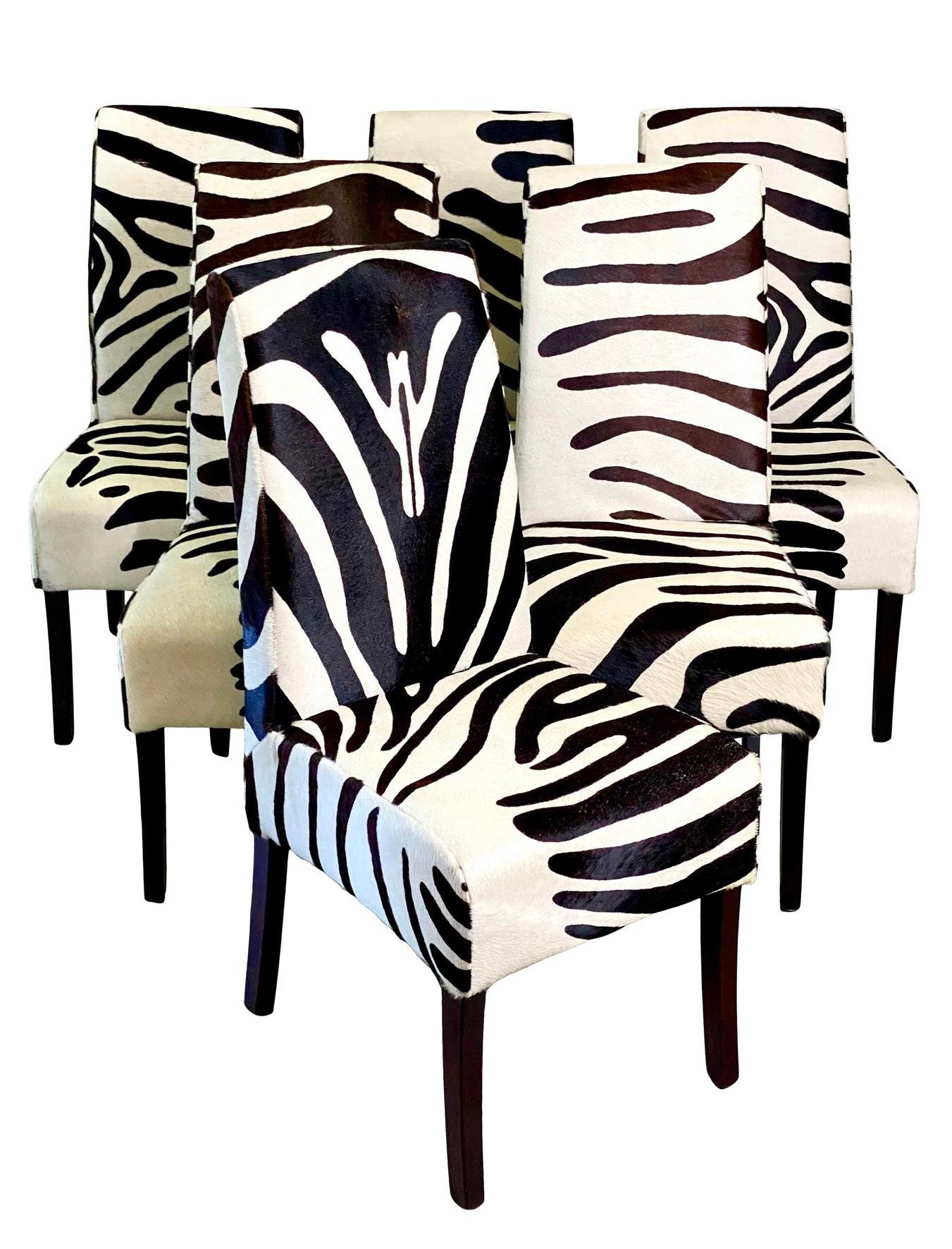 Fantastic set of 6 Palecek dining chairs. Done in a chic zebra with high backs and ebony legs. Acquired from a Palm Beach estate.