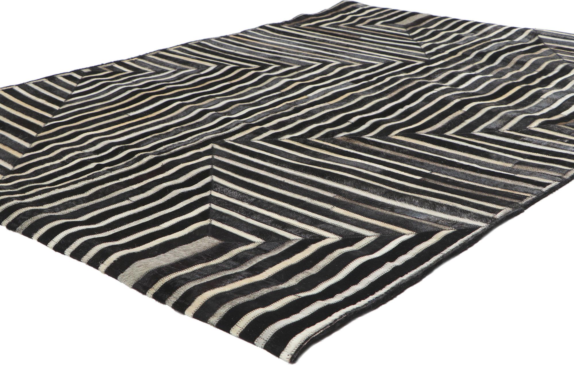 30909 Contemporary Patchwork Cowhide Rug with Modern Style,  04'02 x 05'11. Call the wild indoors and bring a sense of adventure home with this handcrafted cowhide rug. Showcasing a modern design, incredible detail and texture, this leather cowhide