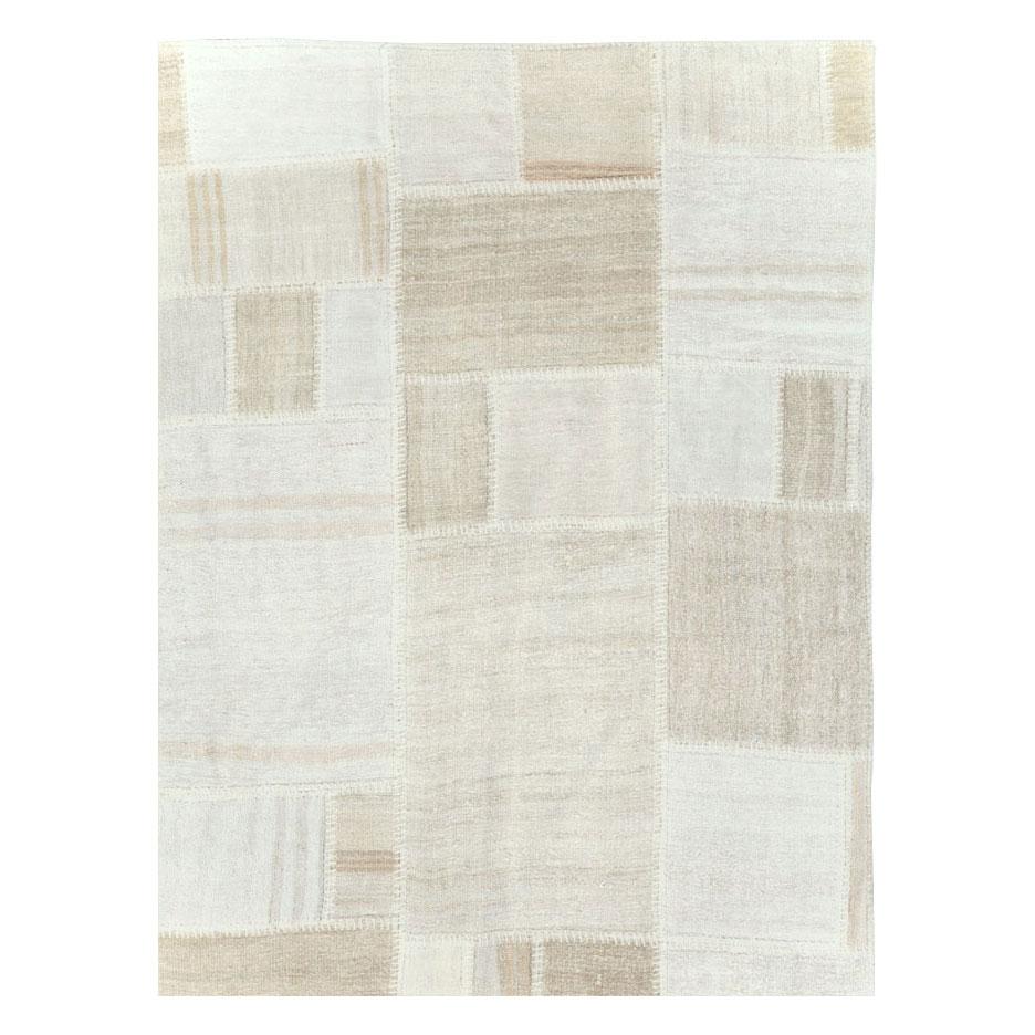 A contemporary Turkish flatweave Kilim large room size carpet handmade during the 21st century in the patchwork style using remnants of vintage Turkish flatweaves from the mid-20th century period.

Measures: 13' 1