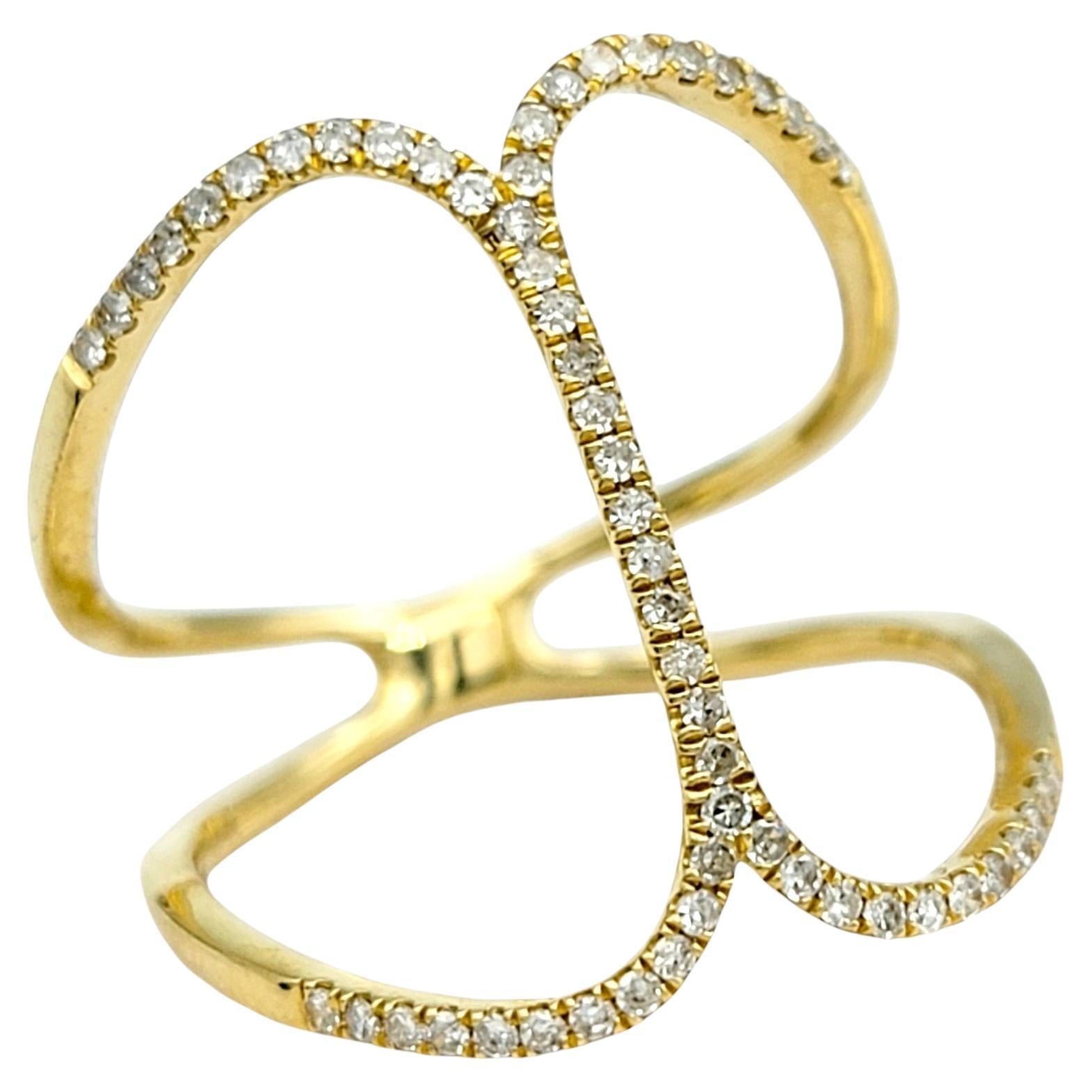 Step into modern elegance with this stunning negative space motif ring, artfully crafted in polished 18 karat yellow gold. This contemporary design creates a striking balance between boldness and delicacy, with its open, airy structure that allows
