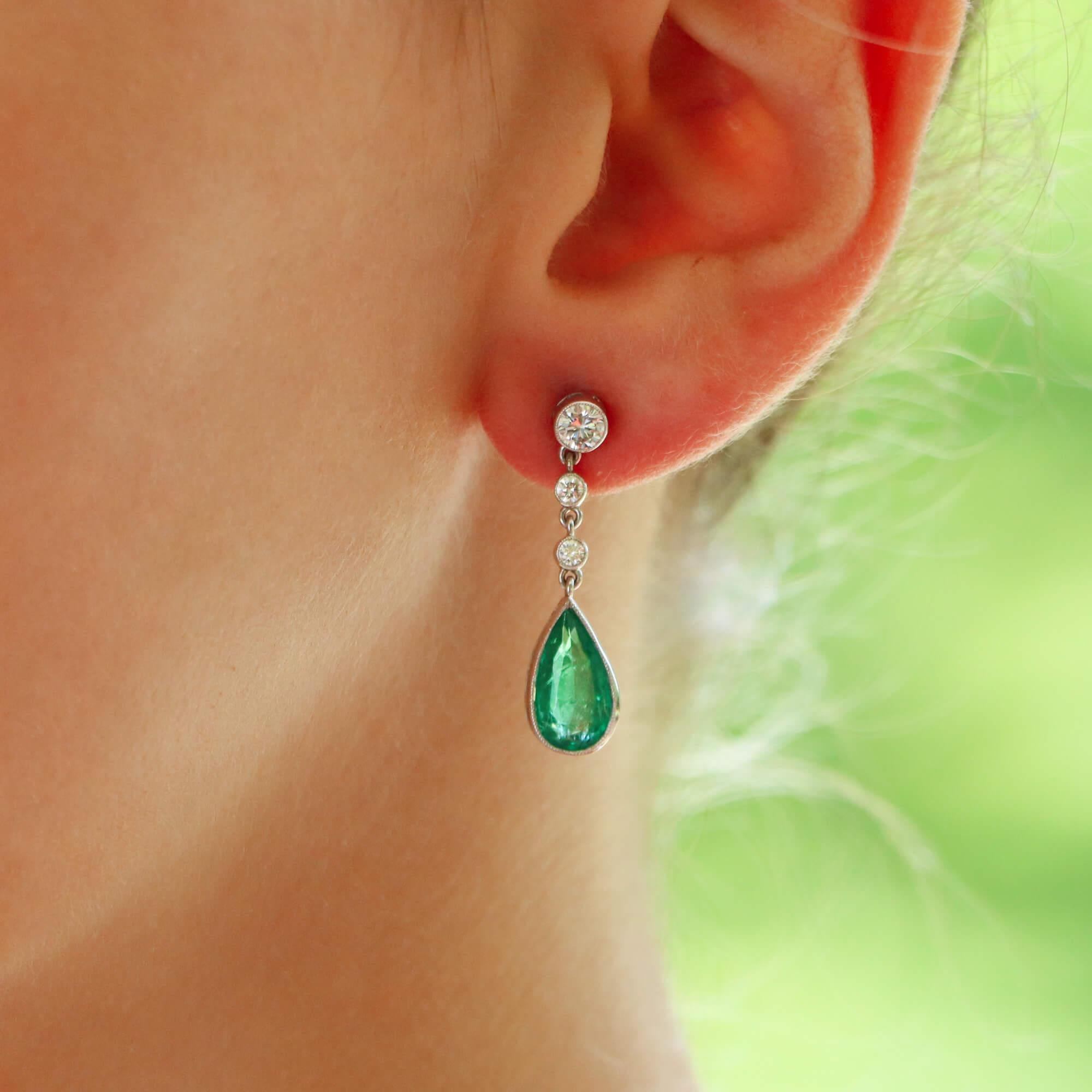 Modern Contemporary Pear Cut Emerald and Diamond Drop Earrings Set in 18k White Gold For Sale