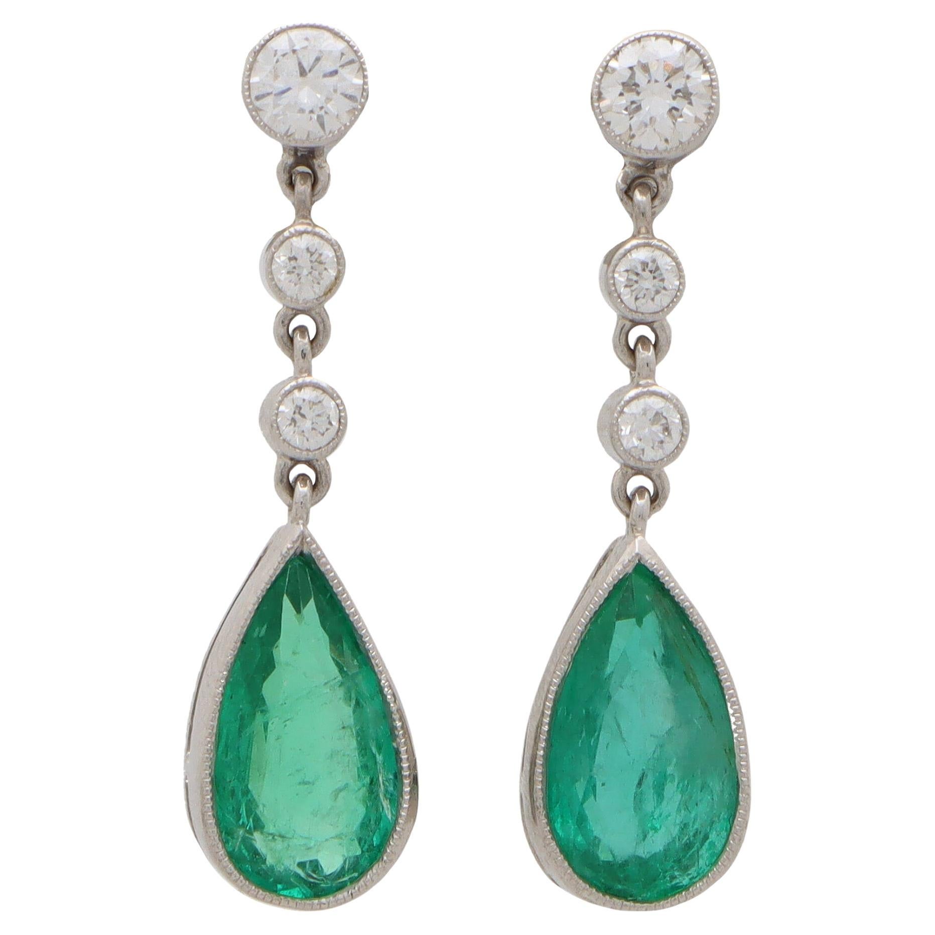 Contemporary Pear Cut Emerald and Diamond Drop Earrings Set in 18k White Gold For Sale