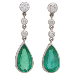 Contemporary Pear Cut Emerald and Diamond Drop Earrings Set in 18k White Gold