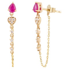 Contemporary Pear Cut Red Ruby & Diamond Chain Drop Earrings in 14K Yellow Gold