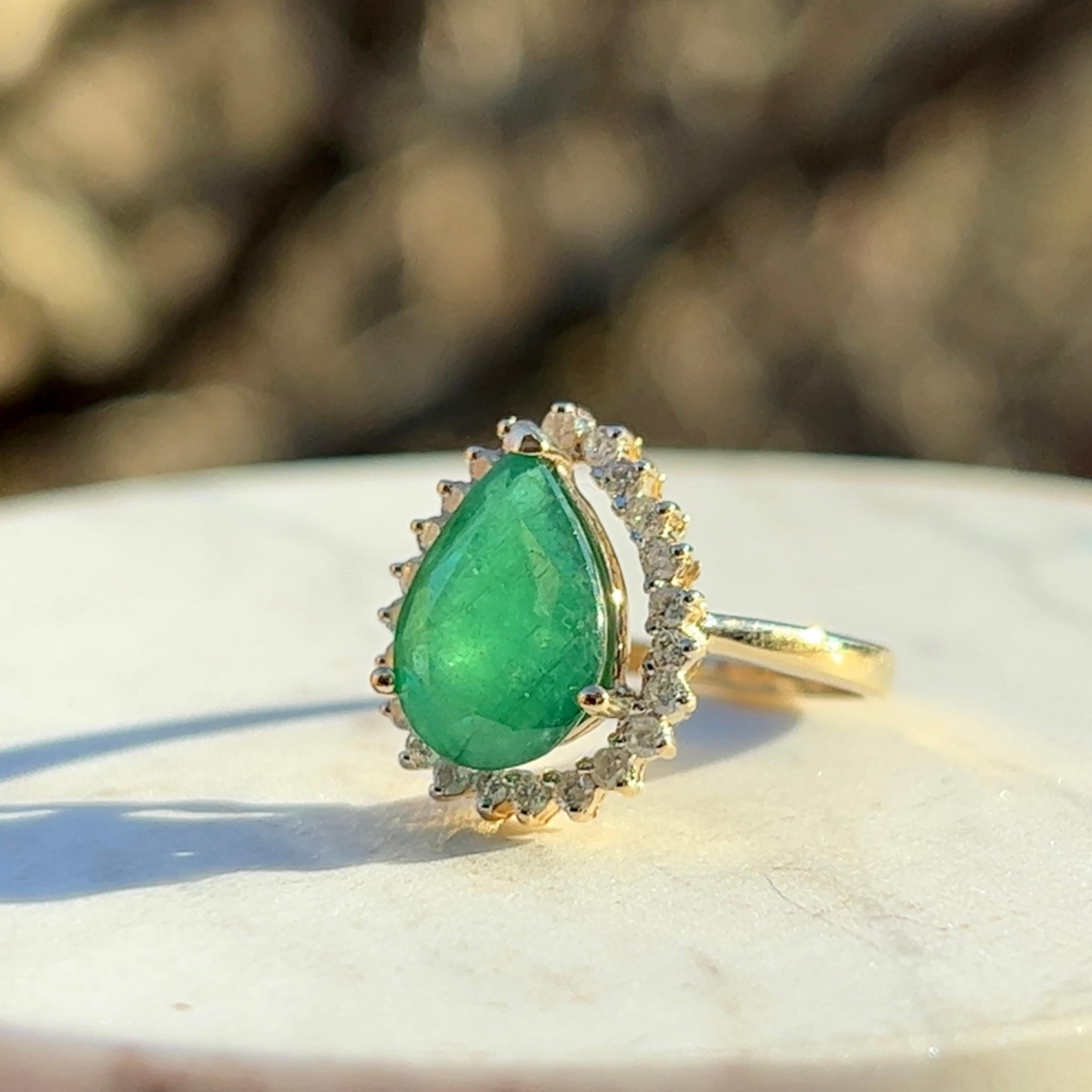 Women's Contemporary Pear Shaped Emerald Diamond Halo Ring in 14K Yellow Gold