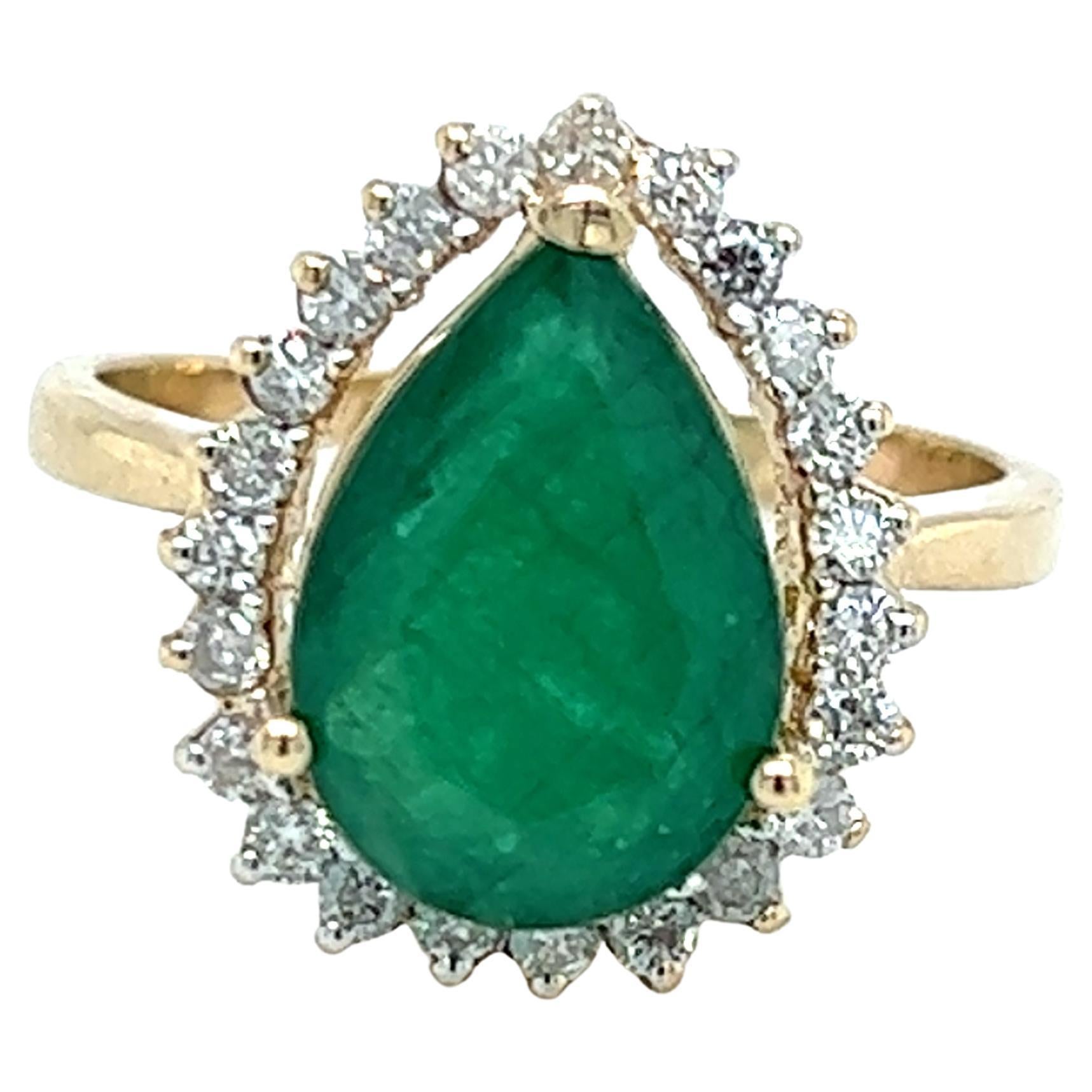 Contemporary Pear Shaped Emerald Diamond Halo Ring in 14K Yellow Gold
