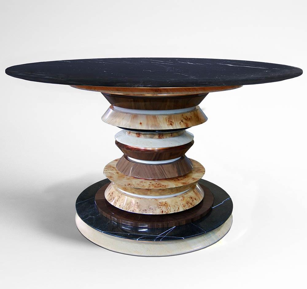 The table is constructed of a central column that has different materials and structures. The pedestal structure consists of mixed layers of Poplar Root, American Walnut, copper leaf, beige cotton velvet, polished Nero Marquina and light Estremoz