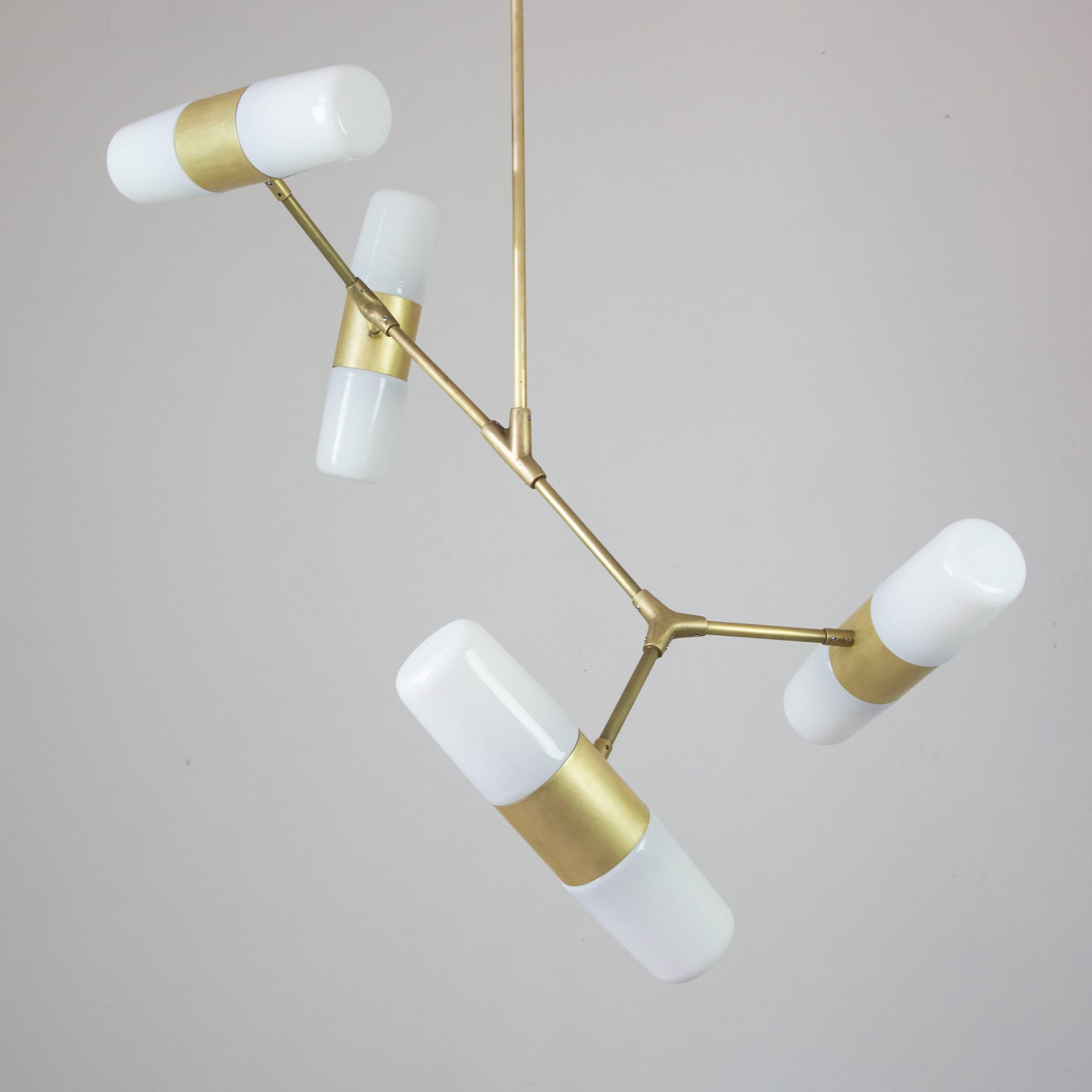 This pendant lamp is inspired by geometric patterns and angles, this lamp was created using traditional metalworking techniques such as cast bronze and handmade brass parts.

With handcrafted bronze connections, this pendant lamp has four double
