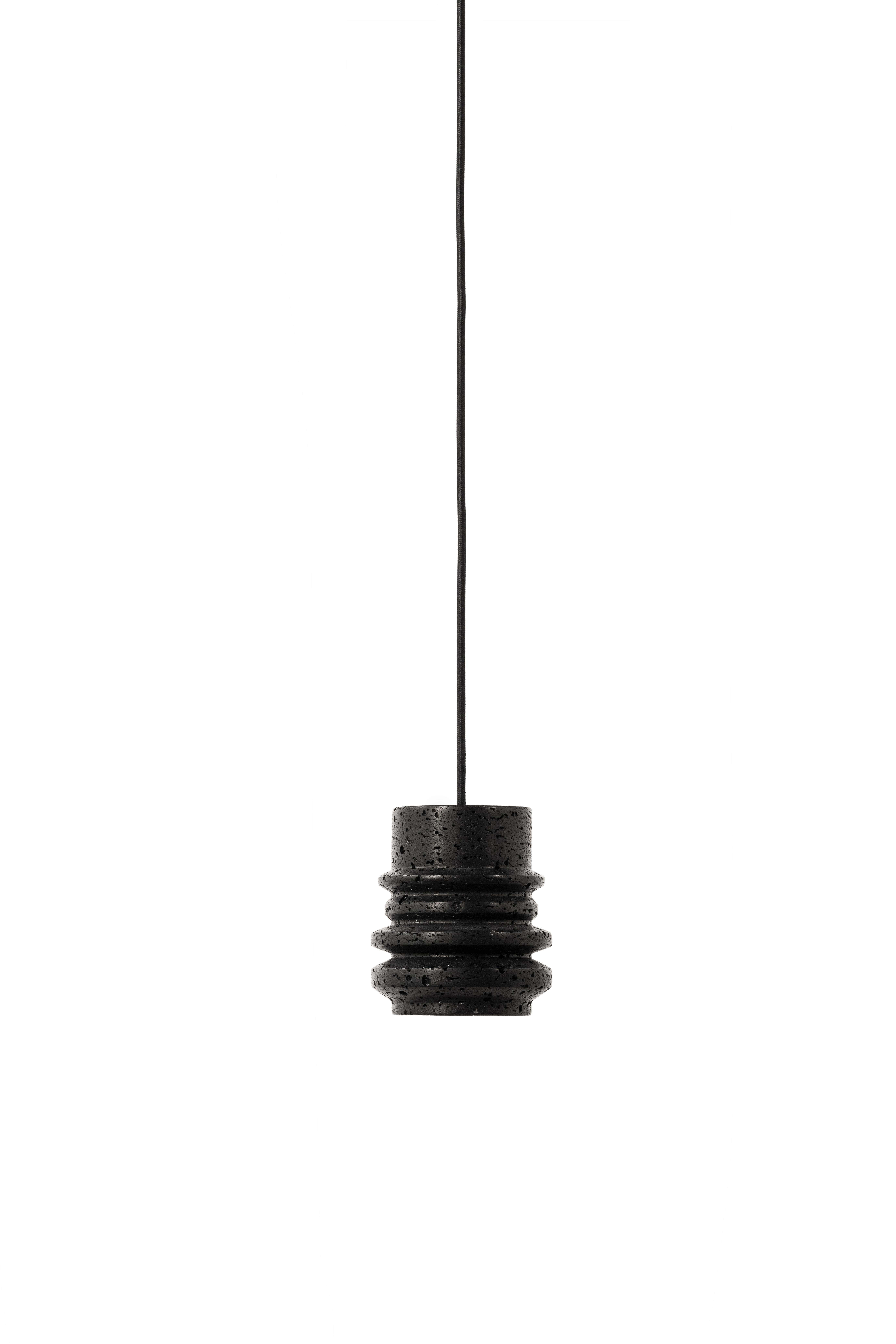 Pendant lamp 'CIRCLE' by Buzao x Bentu design.
Black lava stone

Size: 15 cm high, 13 cm diameter
Wire: 2 meters black (adjustable)
Lamp type: E27 LED 3W 100-240V 80Ra 200LM 2700K - Comptable with US electric system.
Ceiling rose: 6.5cm diameter