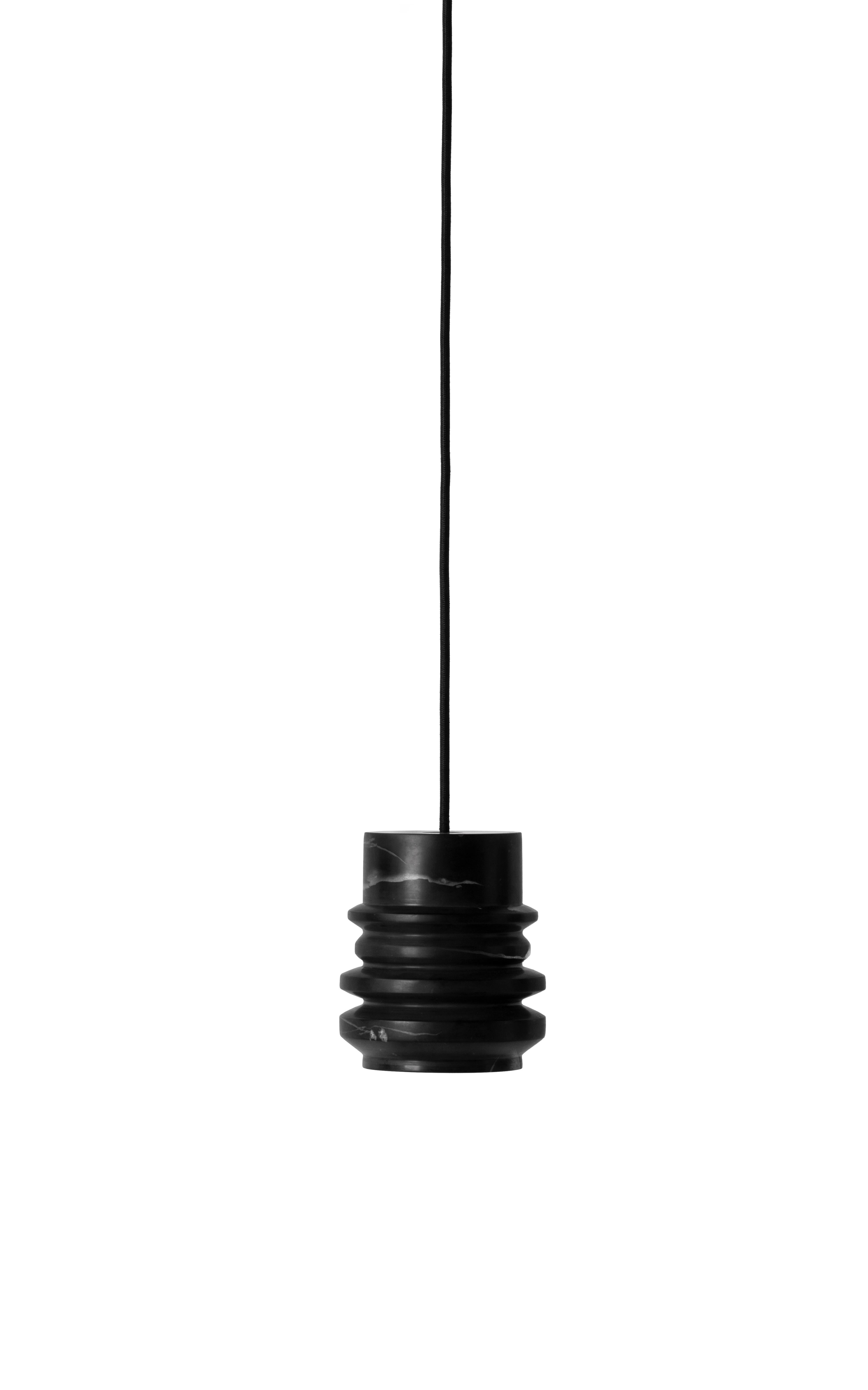 Pendant lamp 'CIRCLE' by Buzao x Bentu design.
Black marble

Measures: 15 cm high, 13 cm diameter
Wire: 2 meters black (adjustable)
Lamp type: E27 LED 3W 100-240V 80Ra 200LM 2700K - Comptable with US electric system.
Ceiling rose 6.5cm diameter