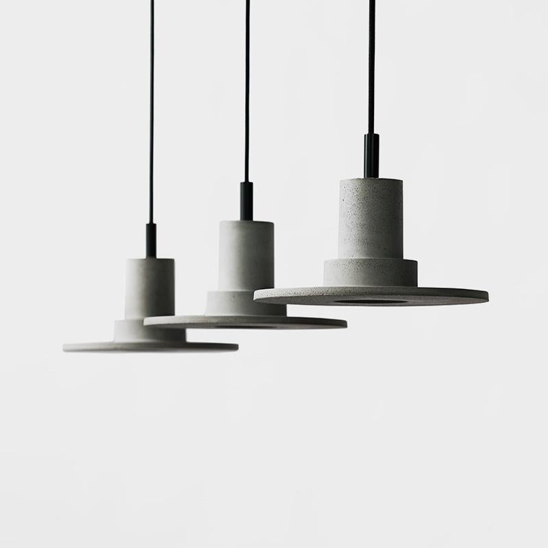 'DIE' pendant lamp in concrete
Dark grey
Light grey

Measures: Ø25 cm × H 17.8 cm

Bulb: E27 COB LED 100-240V 80Ra 240LM 3000K - Comptable with US electric system.

Bentu Design furniture and lightings derive its uniqueness from the simplicity of