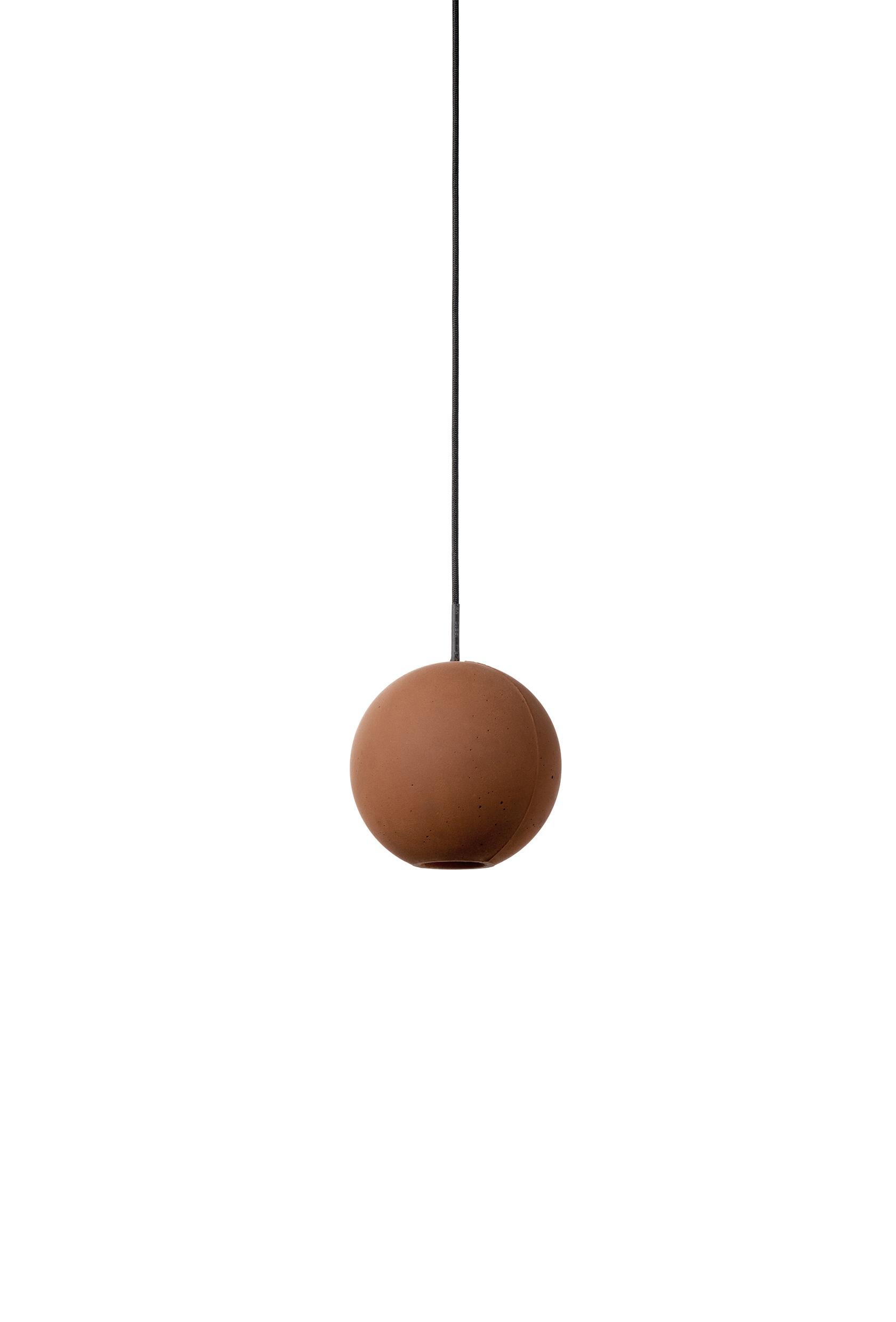 Pendant lamp 'E-mars' by Nongzao x Bentu Design.
Material: Terracotta 
Color: Earthy brown 

Measures: 10.2 cm high, 9.8 cm diameter
Wire: 3 meters (black)
Lamp type: AC 100-240V 50-60Hz 9W - Comptable with US electric