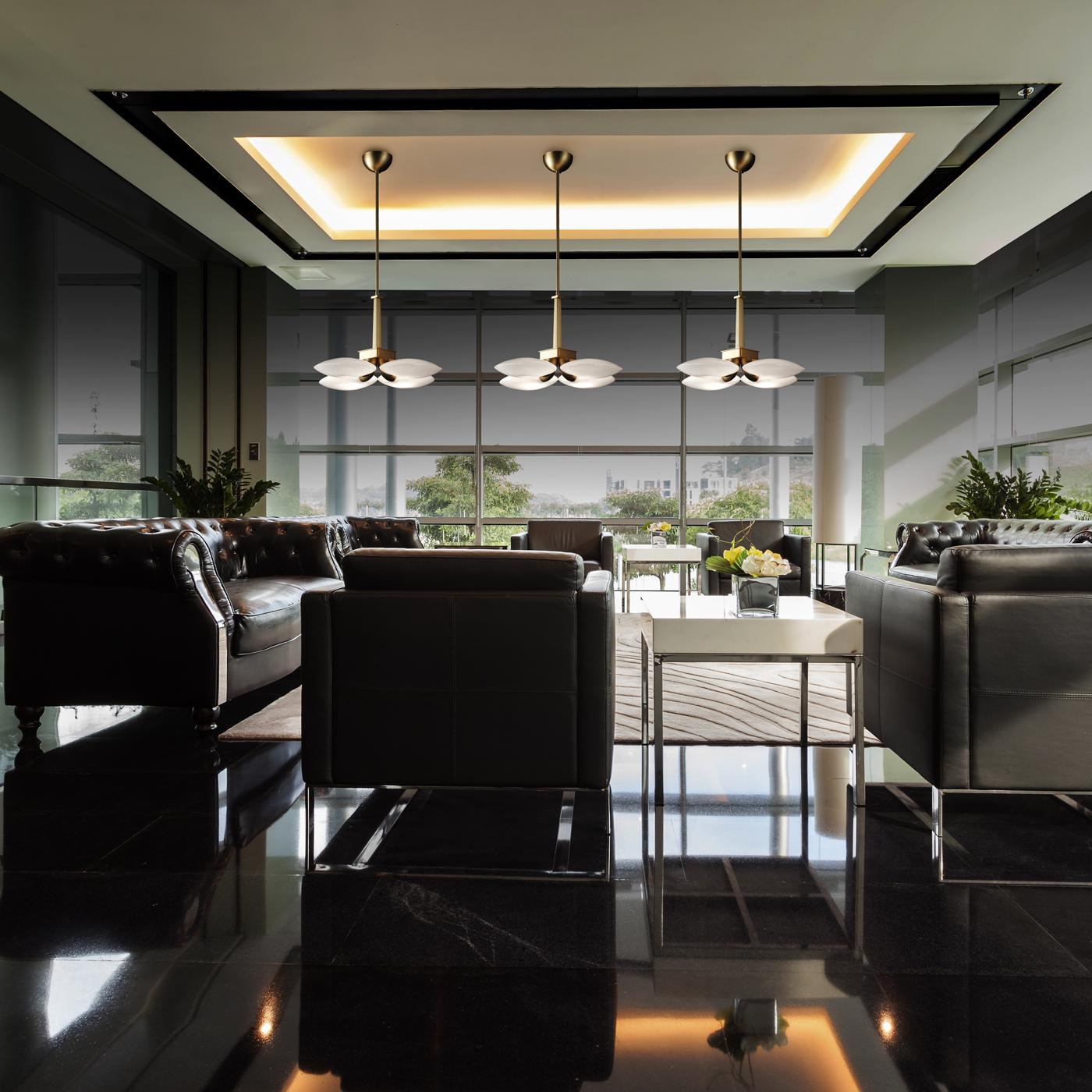 This exclusive pendant lamp boasts a stylish, essential design, fitting a wide variety of polished interiors. The four light sources (each E14 Tubular LED 4W) are hosted in ellipsoidal diffusers in clear glass connected through small tubular metal