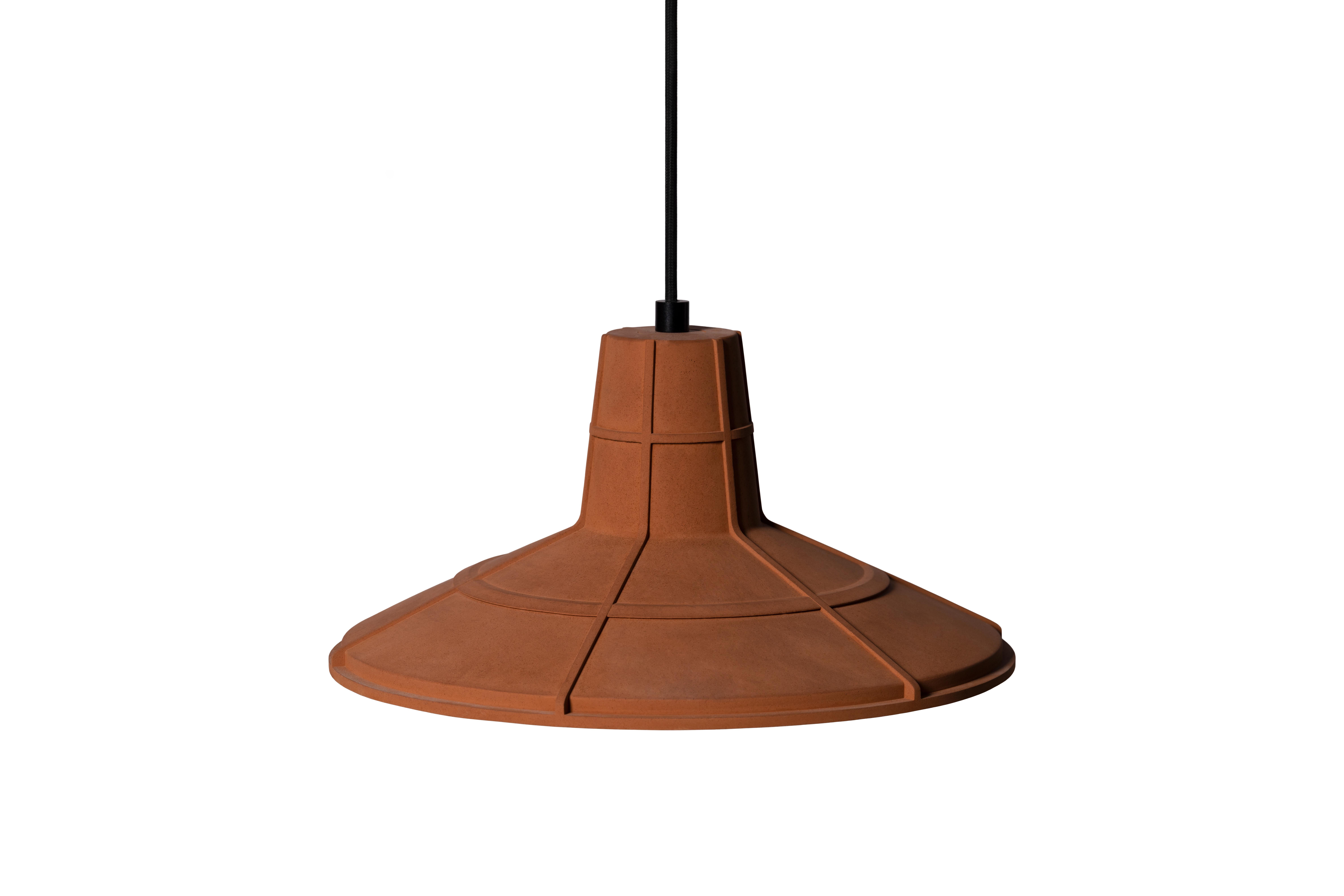 Pendant lamp 'L' by Nongzao x Bentu design.
Material: Terracotta 
Color: Earthy orange

Measures: 17.5 cm high, 36.5 cm diameter
Wire: 3 meters (black)
Lamp type: AC 100-240V 50-60Hz  9W - Comptable with US electric system.

Variations:
- Color: